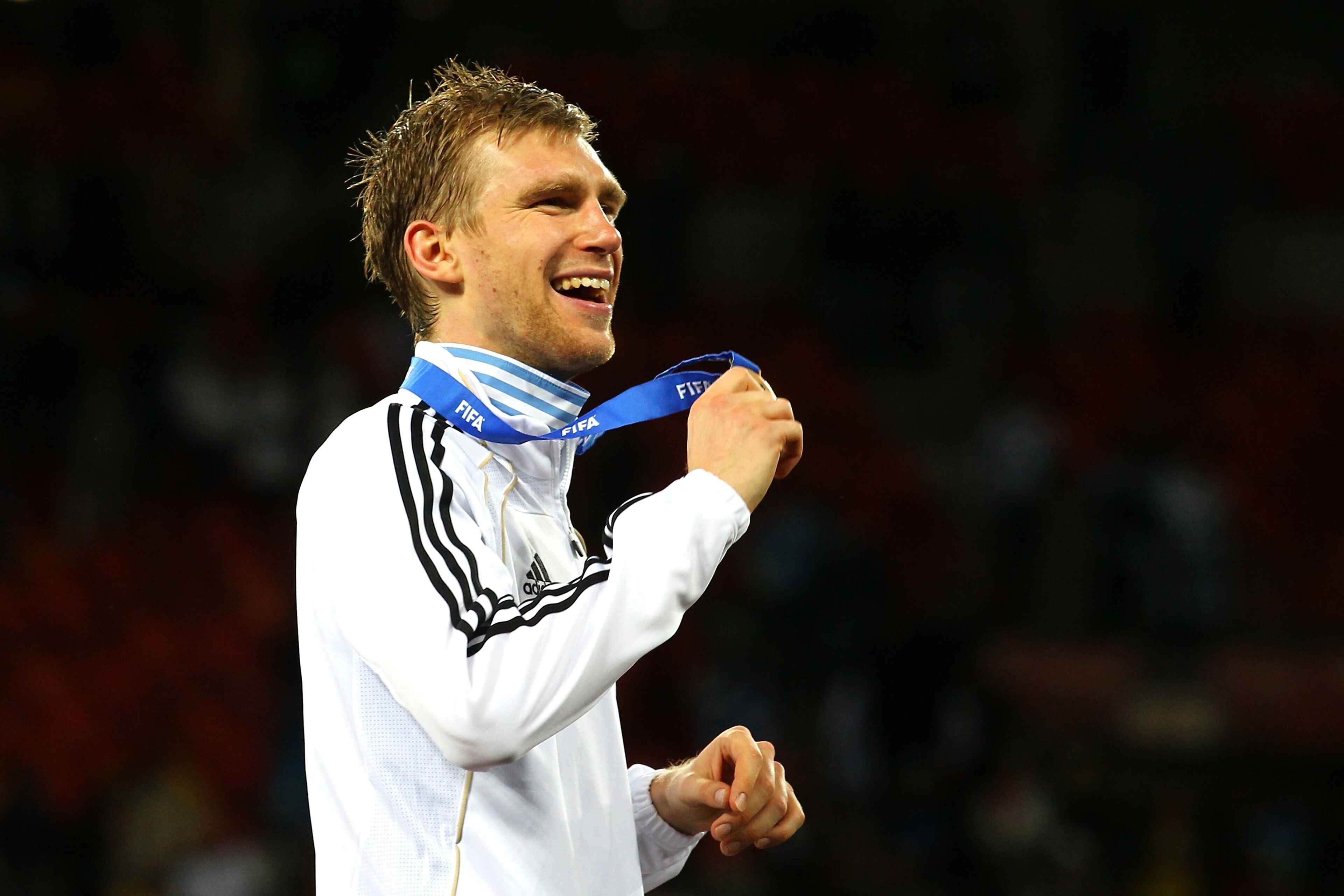 PORT ELIZABETH, SOUTH AFRICA - JULY 10: Per Mertesacker of Germany celebrates victory and third place following the 2010 FIFA World Cup South Africa Third Place Play-off match between Uruguay and Germany at The Nelson Mandela Bay Stadium on July 10, 2010 PORT ELIZABETH, SOUTH AFRICA - JULY 10: Per Mertesacker of Germany celebrates victory and third place following the 2010 FIFA World Cup South Africa Third Place Play-off match between Uruguay and Germany at The Nelson Mandela Bay Stadium on July 10, 2010