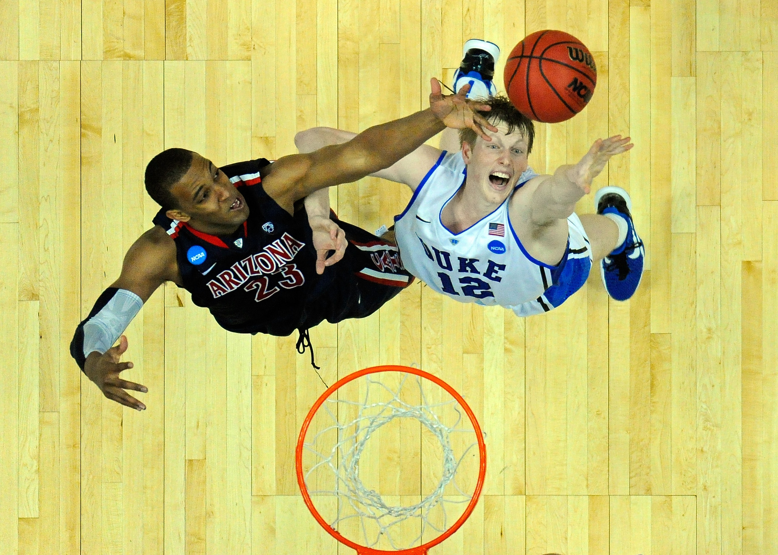 ANAHEIM, CA - MARCH 24:  Derrick Williams #23 of the Arizona Wildcats fights for a rebound against Kyle Singler #12 of the Duke Blue Devils during the west regional semifinal of the 2011 NCAA men's basketball tournament at the Honda Center on March 24, 20