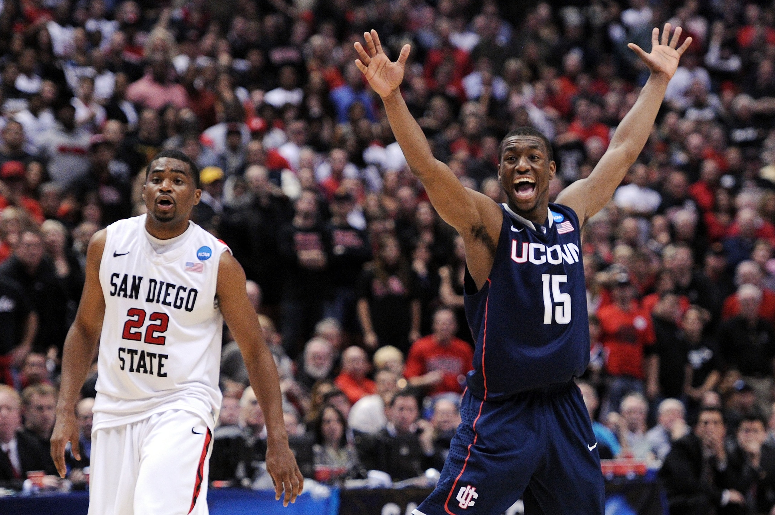 ANAHEIM, CA - MARCH 24:  Kemba Walker #15 of the Connecticut Huskies reacts after a play against Chase Tapley #22 of the San Diego State Aztecs looks on during the west regional semifinal of the 2011 NCAA men's basketball tournament at the Honda Center on