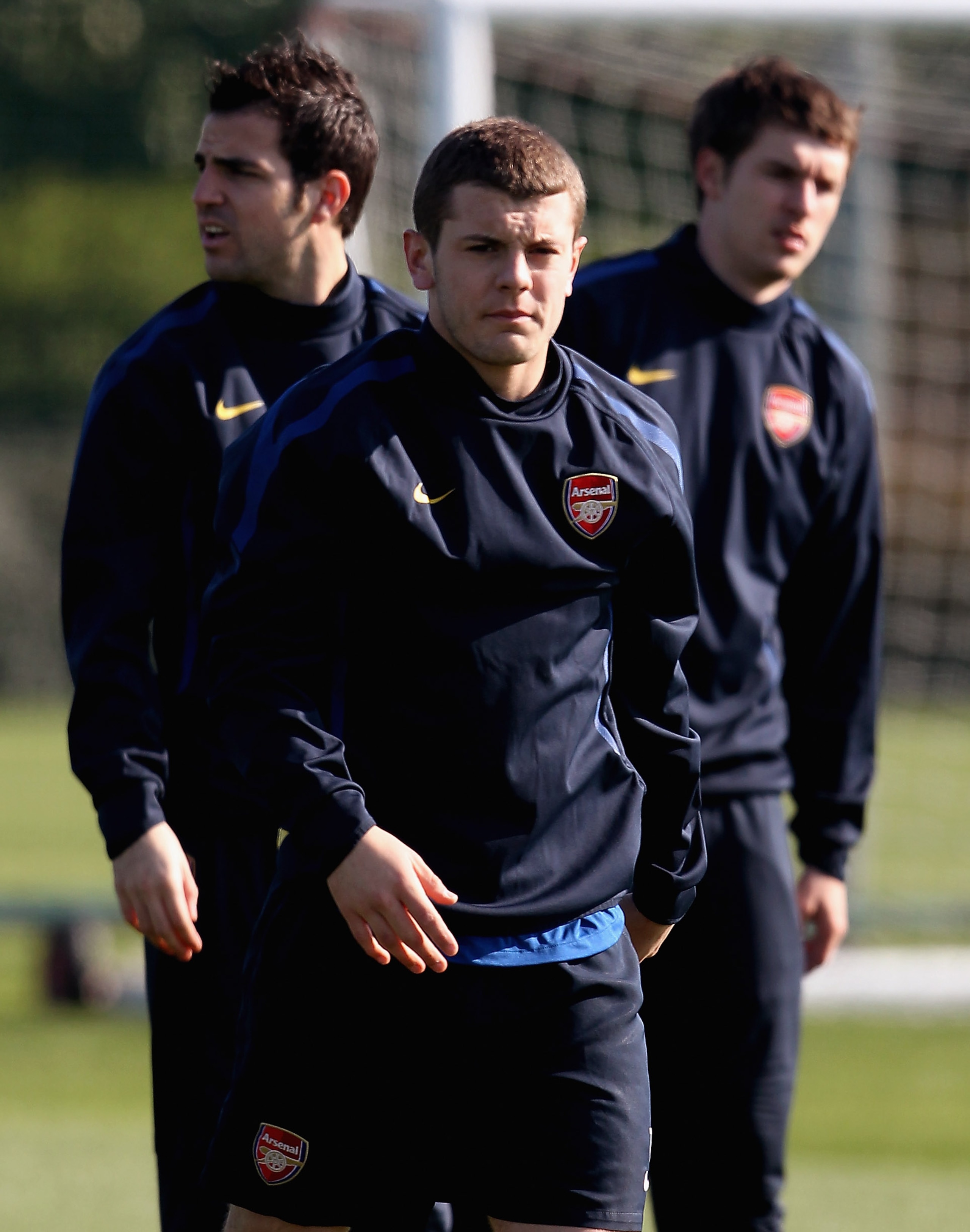 ST ALBANS, ENGLAND - MARCH 07:  Arsenal's midfield trio of Cesc Fabregas (L), Jack Wilshere (C) and Aaron Ramsey during a training session ahead of the UEFA Champions League Round of 16 second leg match against Barcelona at London Colney on March 7, 2011