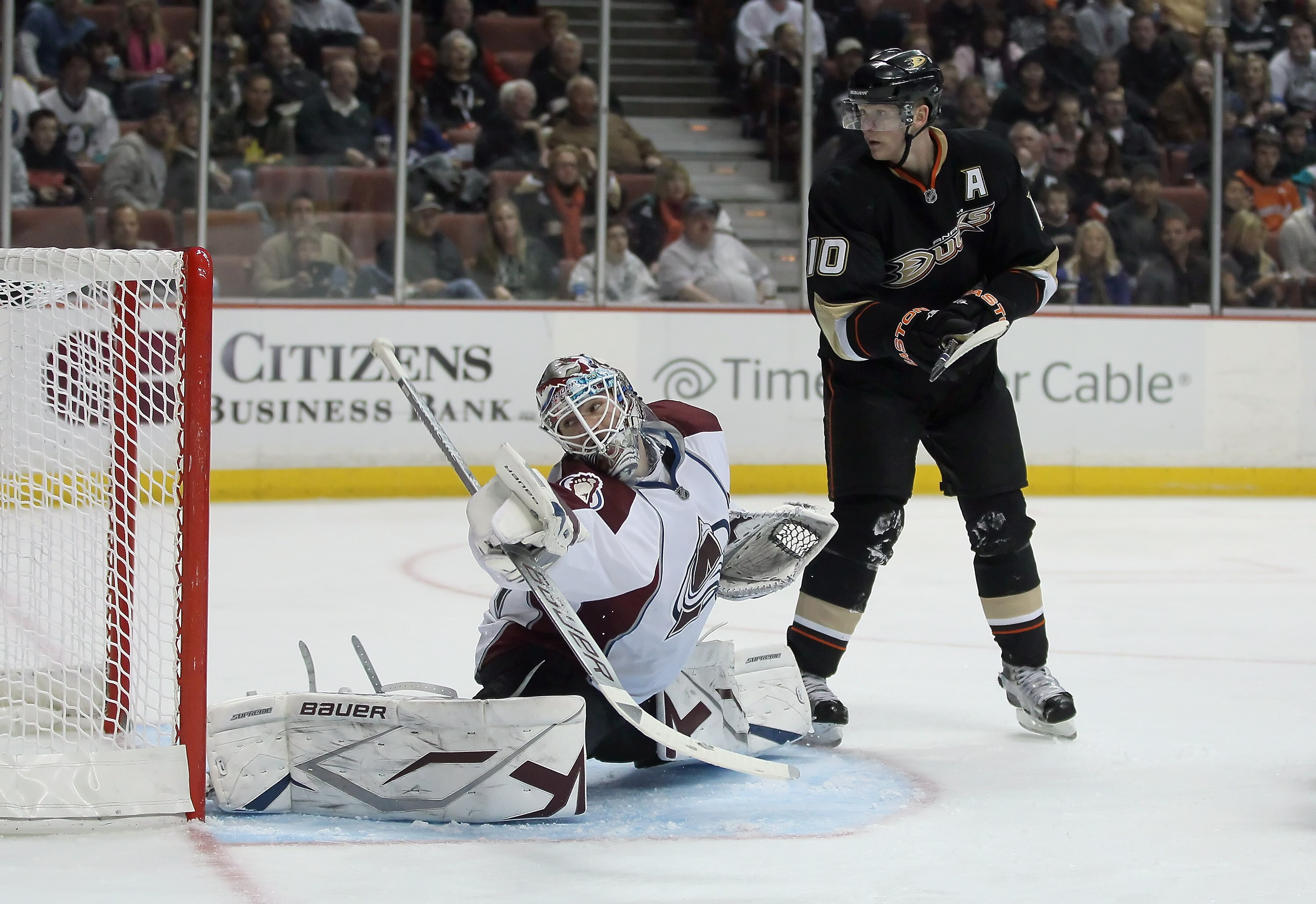 ANAHEIM, CA - FEBRUARY 27:  Goaltender Peter Budaj #31 of the Colorado Avalanche lunges to make a save as Corey Perry #10 of the Anaheim Ducks pursues at Honda Center on February 27, 2011 in Anaheim, California.  (Photo by Jeff Gross/Getty Images)