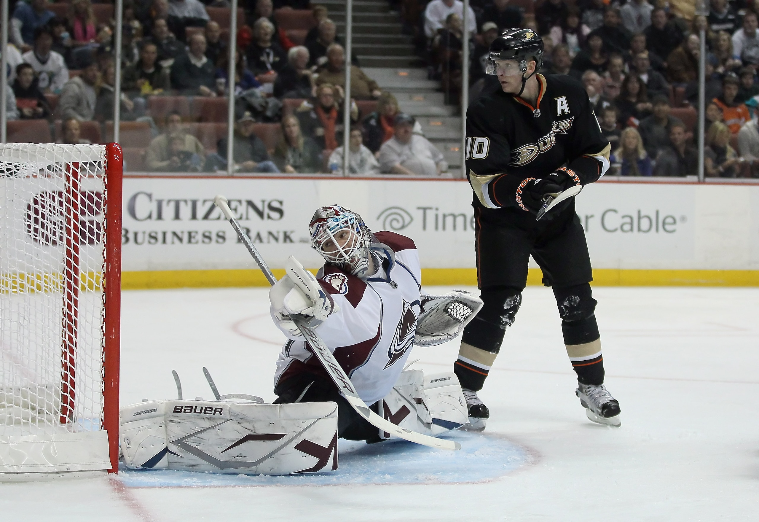 ANAHEIM, CA - FEBRUARY 27:  Goaltender Peter Budaj #31 of the Colorado Avalanche lunges to make a save as Corey Perry #10 of the Anaheim Ducks pursues at Honda Center on February 27, 2011 in Anaheim, California.  (Photo by Jeff Gross/Getty Images)