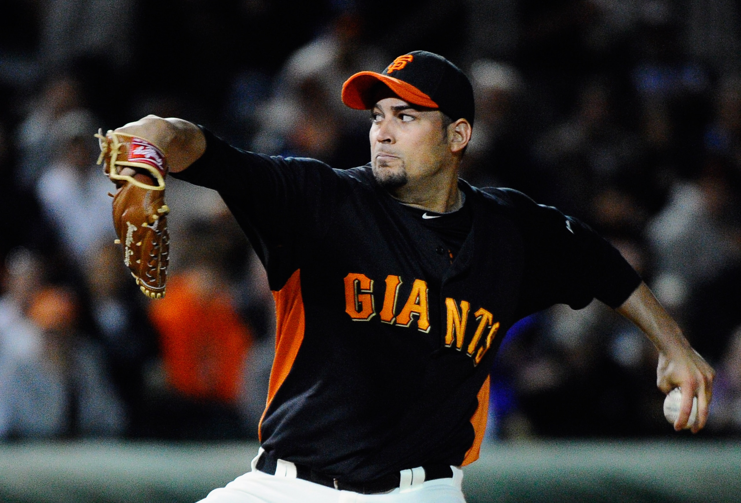 SCOTTSDALE, AZ - MARCH 07:  Pitcher Jonathan Sanchez #57 of the San Francisco Giants throws a pitch against the Texas Rangers in the first meeting between the two teams since the World Series at a spring training baseball game at Scottsdale Stadium on Mar