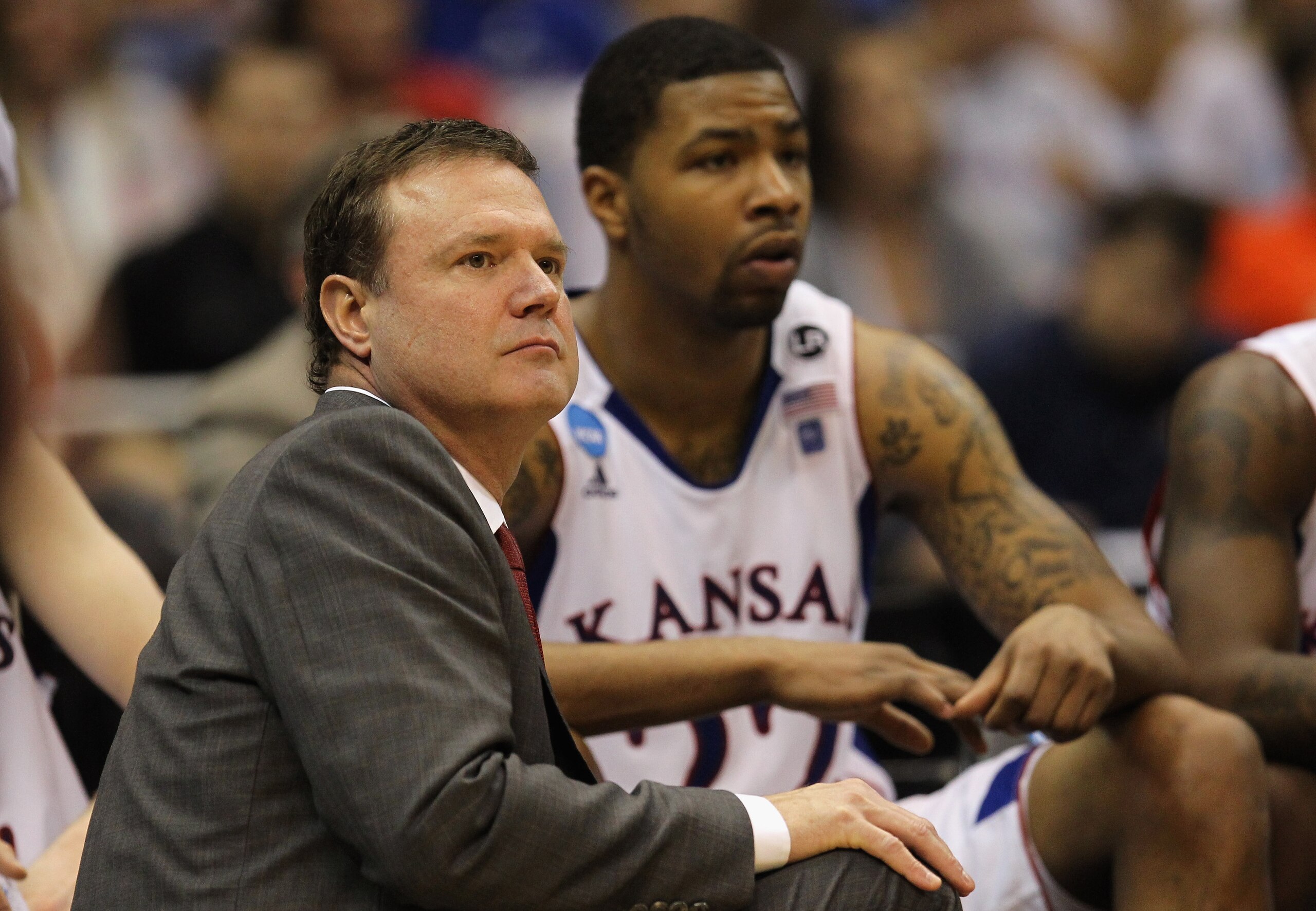SAN ANTONIO, TX - MARCH 25:  Head coach Bill Self of the Kansas Jayhawks and Marcus Morris look on during the southwest regional of the 2011 NCAA men's basketball tournament at the Alamodome against the Richmond Spiders on March 25, 2011 in San Antonio, T