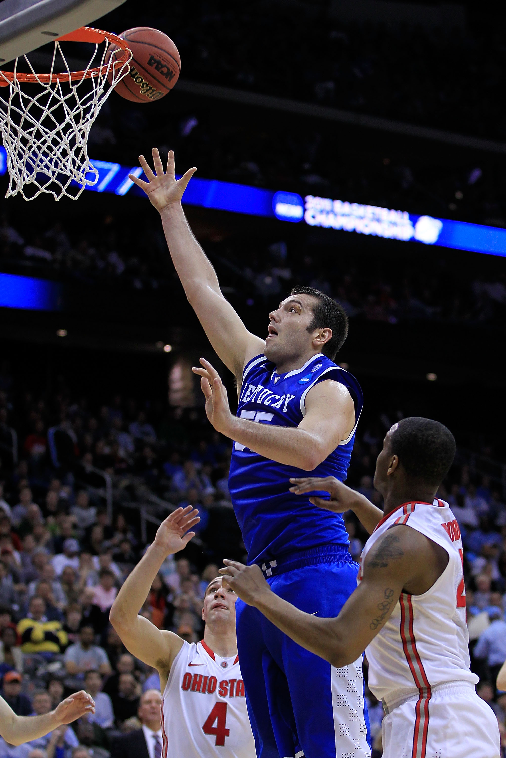 NEWARK, NJ - MARCH 25:  Josh Harrellson #55 of the Kentucky Wildcats takes a shot against the Ohio State Buckeyes during the first half of the east regional semifinal of the 2011 NCAA Men's Basketball Tournament at the Prudential Center on March 25, 2011