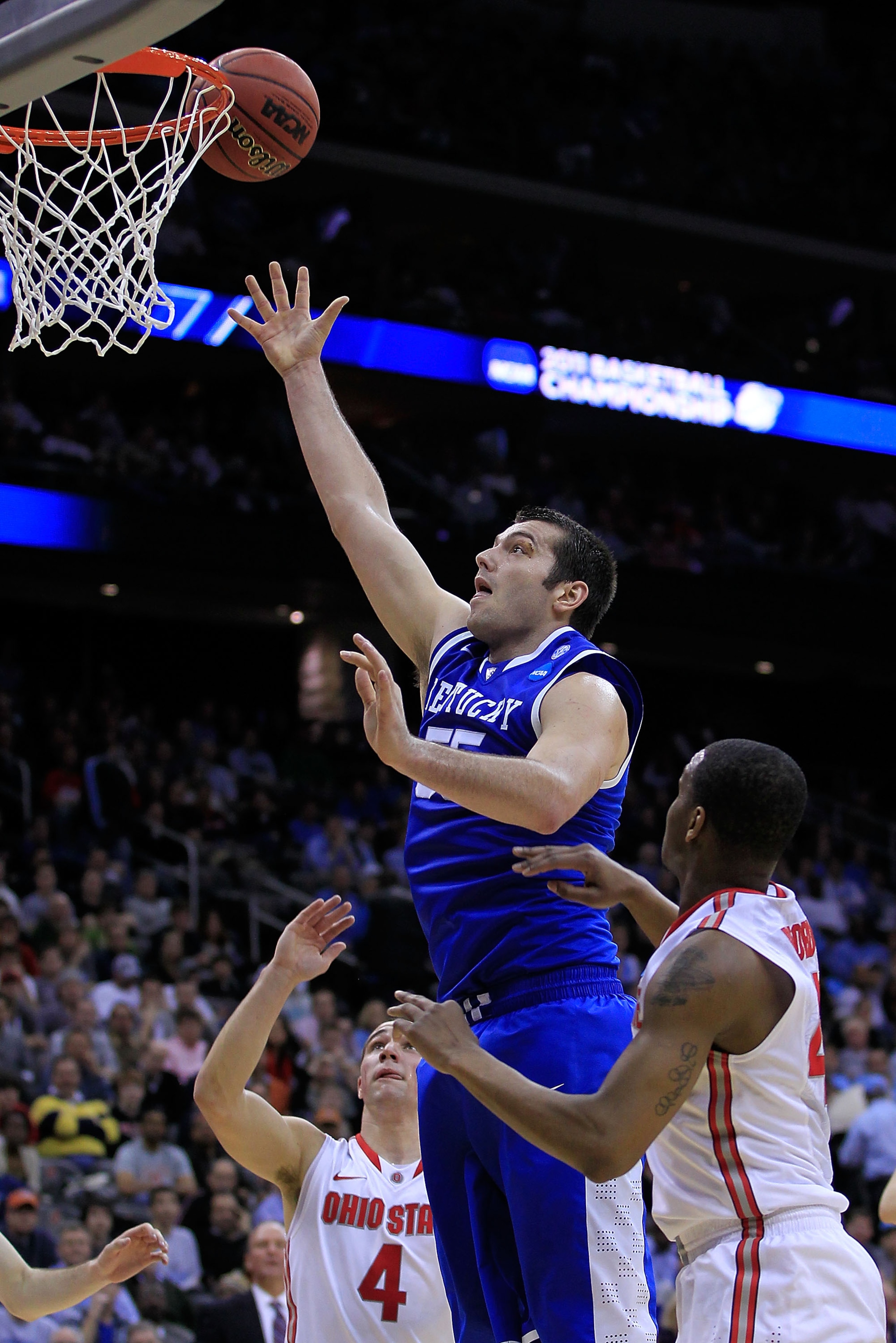 NEWARK, NJ - MARCH 25: Josh Harrellson #55 of the Kentucky Wildcats takes a shot against the Ohio State Buckeyes during the first half of the east regional semifinal of the 2011 NCAA Men's Basketball Tournament at the Prudential Center on March 25, 2011 NEWARK, NJ - MARCH 25: Josh Harrellson #55 of the Kentucky Wildcats takes a shot against the Ohio State Buckeyes during the first half of the east regional semifinal of the 2011 NCAA Men's Basketball Tournament at the Prudential Center on March 25, 2011