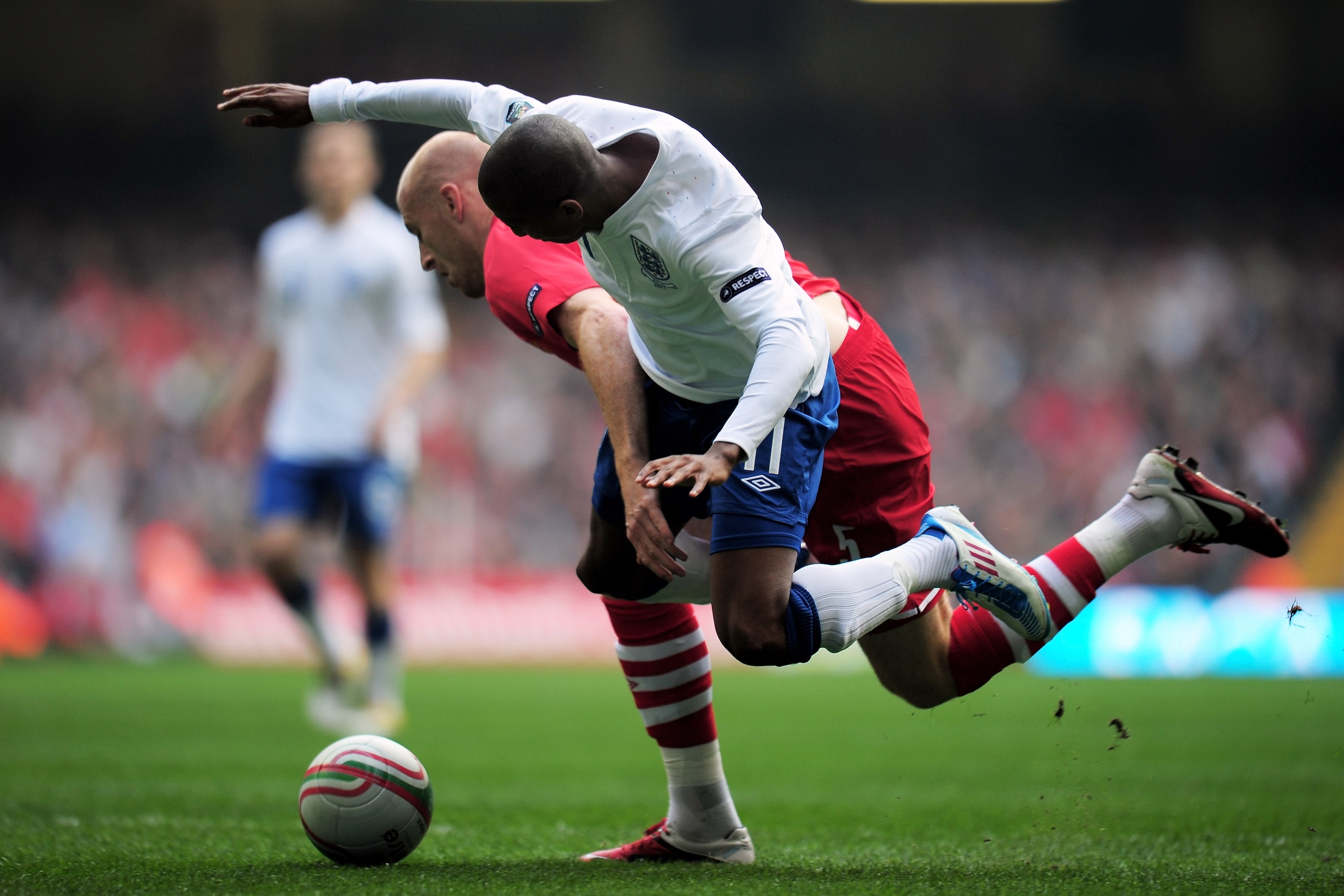 CARDIFF, WALES - MARCH 26:  Ashley Young of England is brought down by James Collins of Wales to win a penalty during the UEFA EURO 2012 Group G qualifying match between Wales and England at the Millennium Stadium on March 26, 2011 in Cardiff, Wales.  (Ph