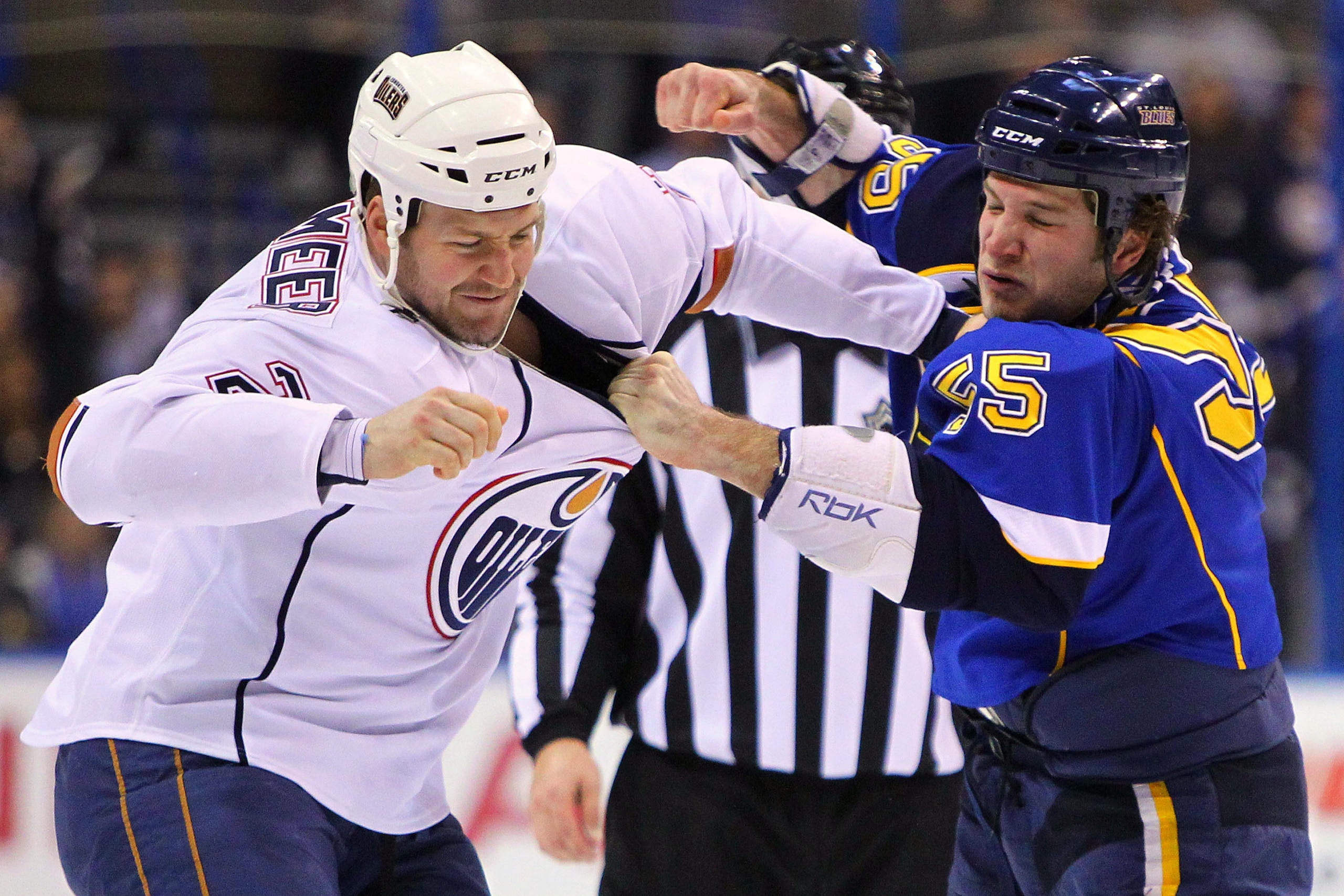 ST. LOUIS, MO - MARCH 24: Jim Vandermeer #2 of the Edmonton Oilers fights Cam Janssen #55 of the St. Louis Blues at the Scottrade Center on March 24, 2011 in St. Louis, Missouri.  (Photo by Dilip Vishwanat/Getty Images)