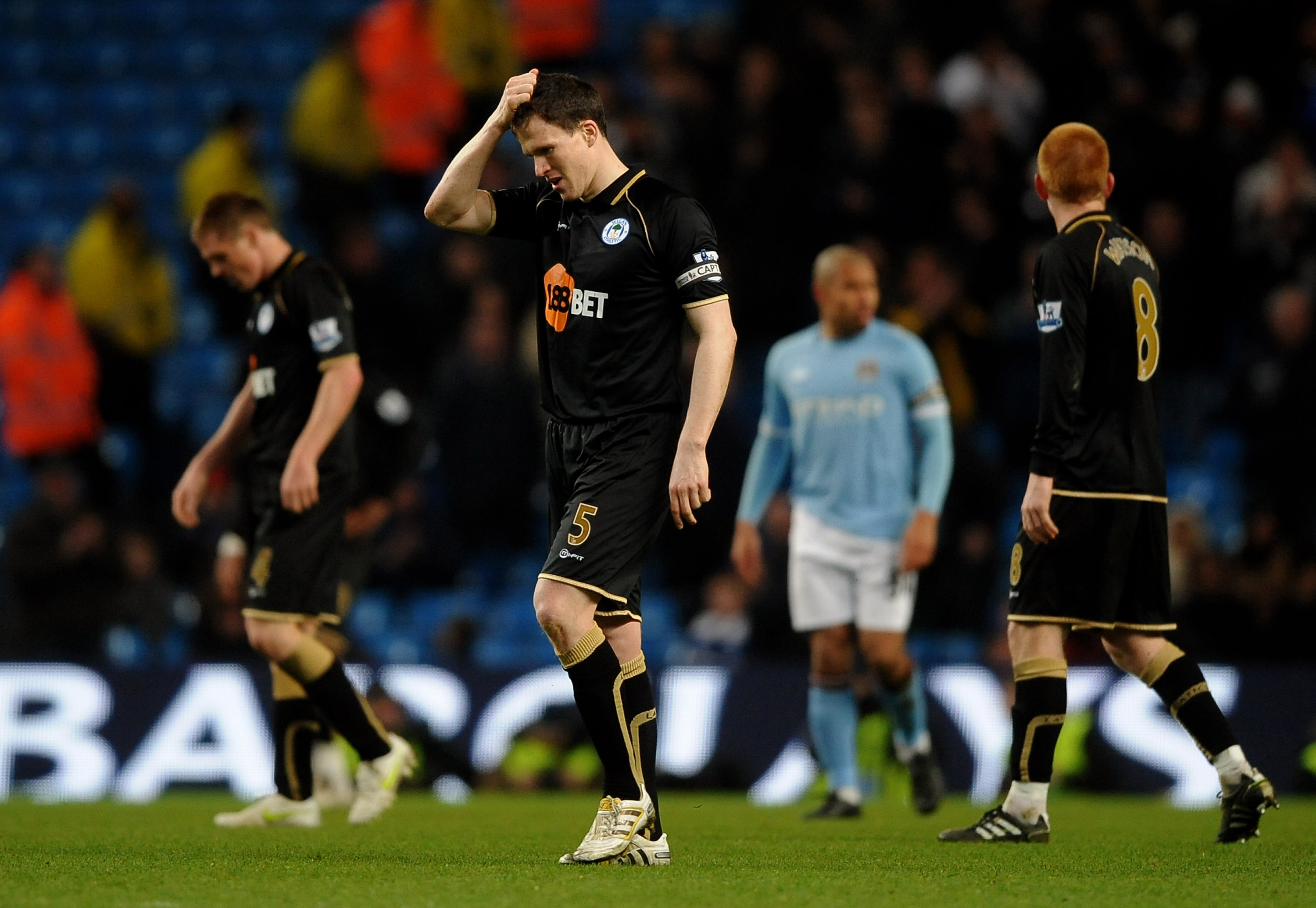 MANCHESTER, UNITED KINGDOM - MARCH 05:   Gary Caldwell of Wigan Athletic look dejected at the end of the Barclays Premier League match between Manchester City and Wigan Athletic at the City of Manchester Stadium on March 5, 2011 in Manchester, England. (P