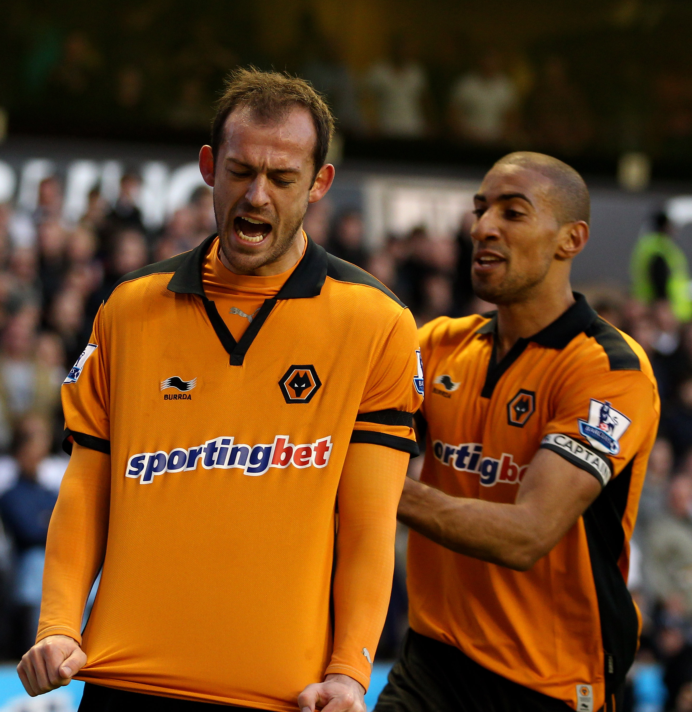 WOLVERHAMPTON, ENGLAND - MARCH 06:  Steven Fletcher (L) of Wolves celebrates scoring the equalising goal with teammate Karl Henry during the Barclays Premier League match between Wolverhampton Wanderers and Tottenham Hotspur at Molineux on March 6, 2011 i
