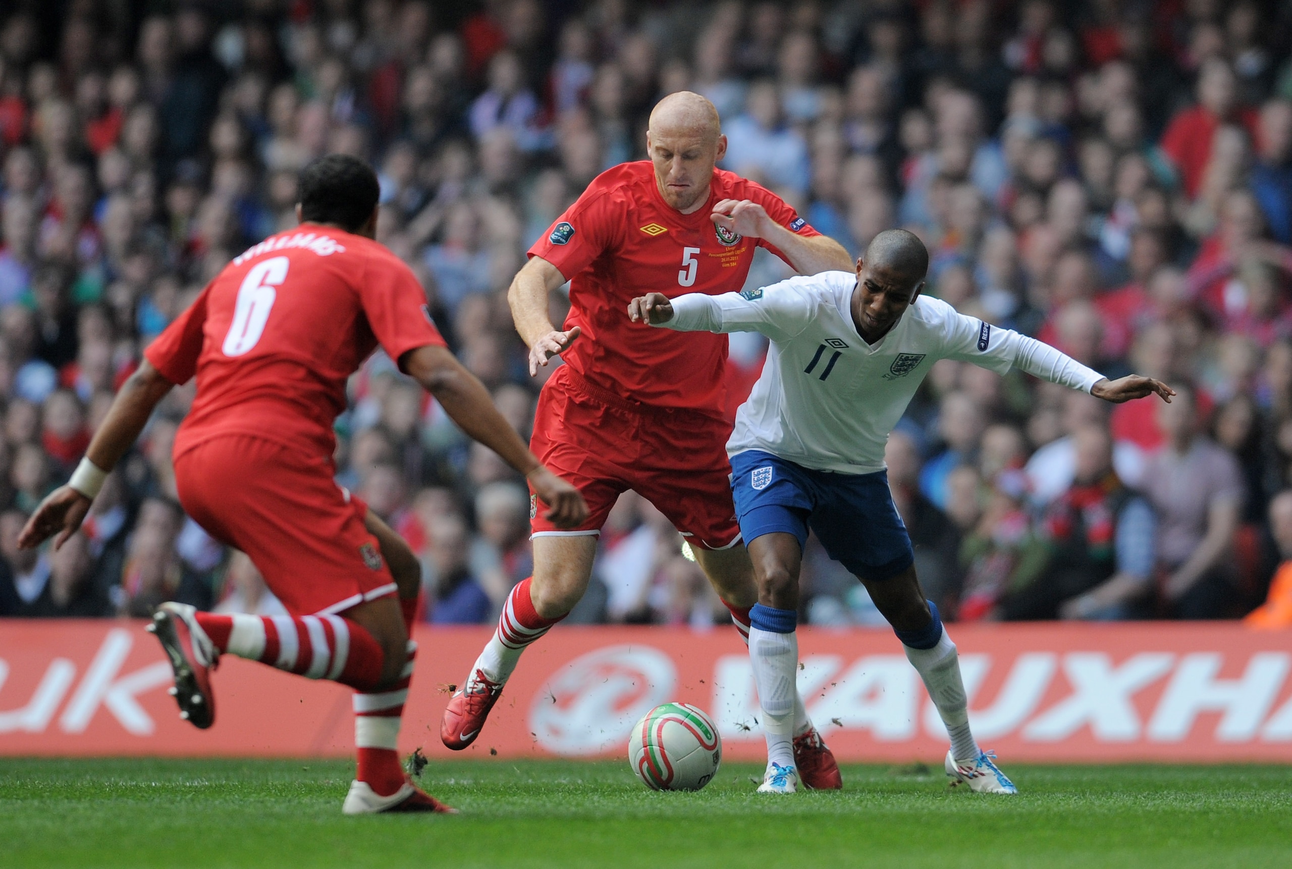 CARDIFF, WALES - MARCH 26:  Ashley Young of England is brought down by James Collins of Wales to win a penalty during the UEFA EURO 2012 Group G qualifying match between Wales and England at the Millennium Stadium on March 26, 2011 in Cardiff, Wales.  (Ph