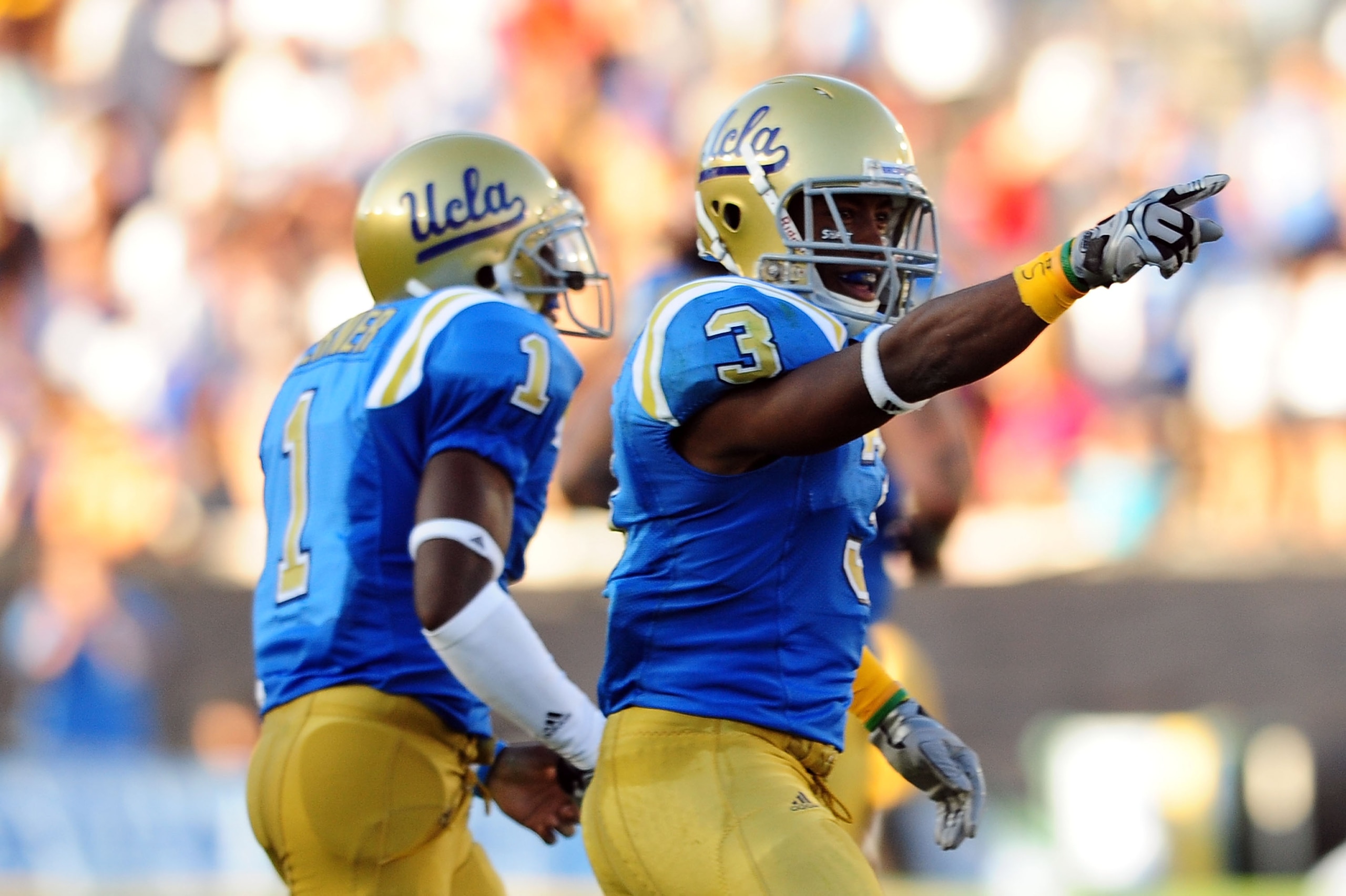 PASADENA, CA - SEPTEMBER 05:  Rahim Moore #3 and Alterraun Verner #1 of the UCLA Bruins celebrate a great play against San Diego State at the Rose Bowl on September 5, 2009 in Pasadena, California.  (Photo by Jacob de Golish/Getty Images)
