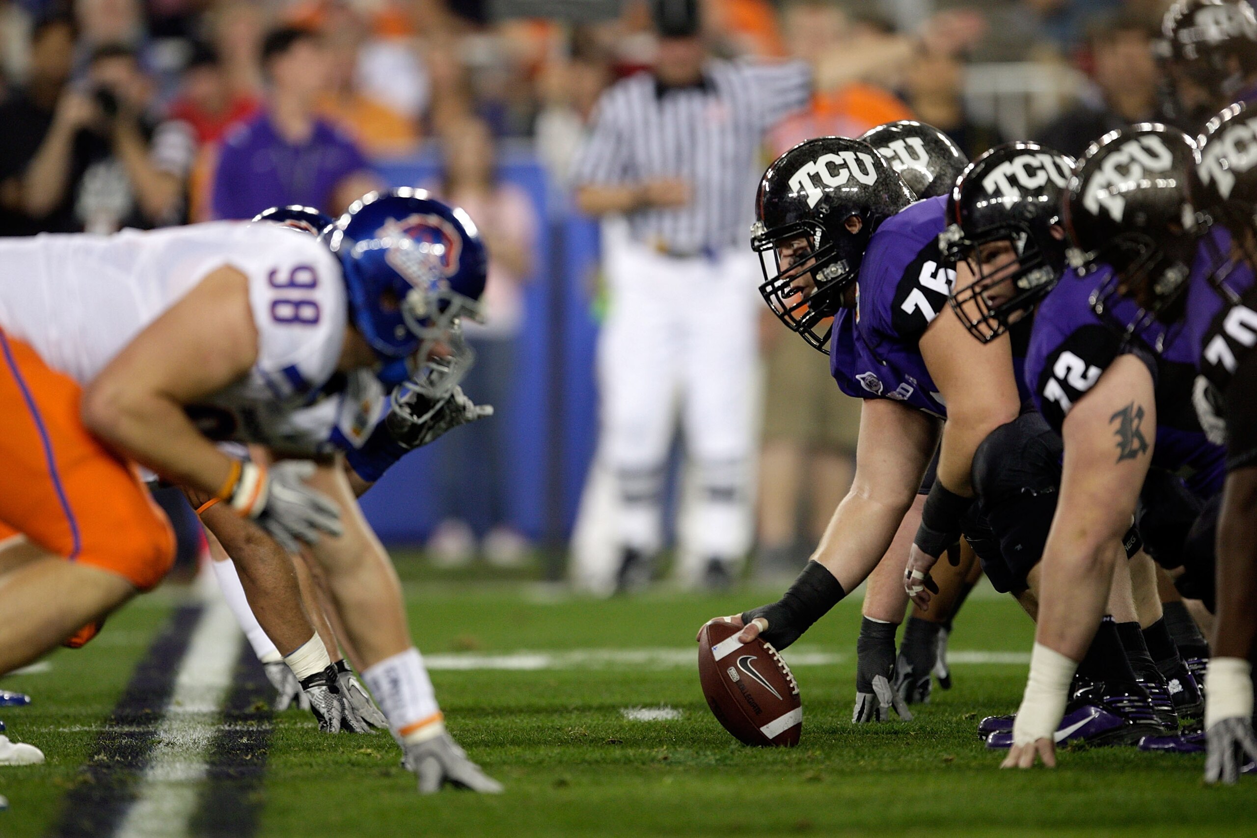 GLENDALE, AZ - JANUARY 04:  Jake Kirkpatrick #76 of the TCU Horned Frogs gets ready to hike the football in the first half against the Boise State Broncos during the Tostitos Fiesta Bowl at the Universtity of Phoenix Stadium on January 4, 2010 in Glendale