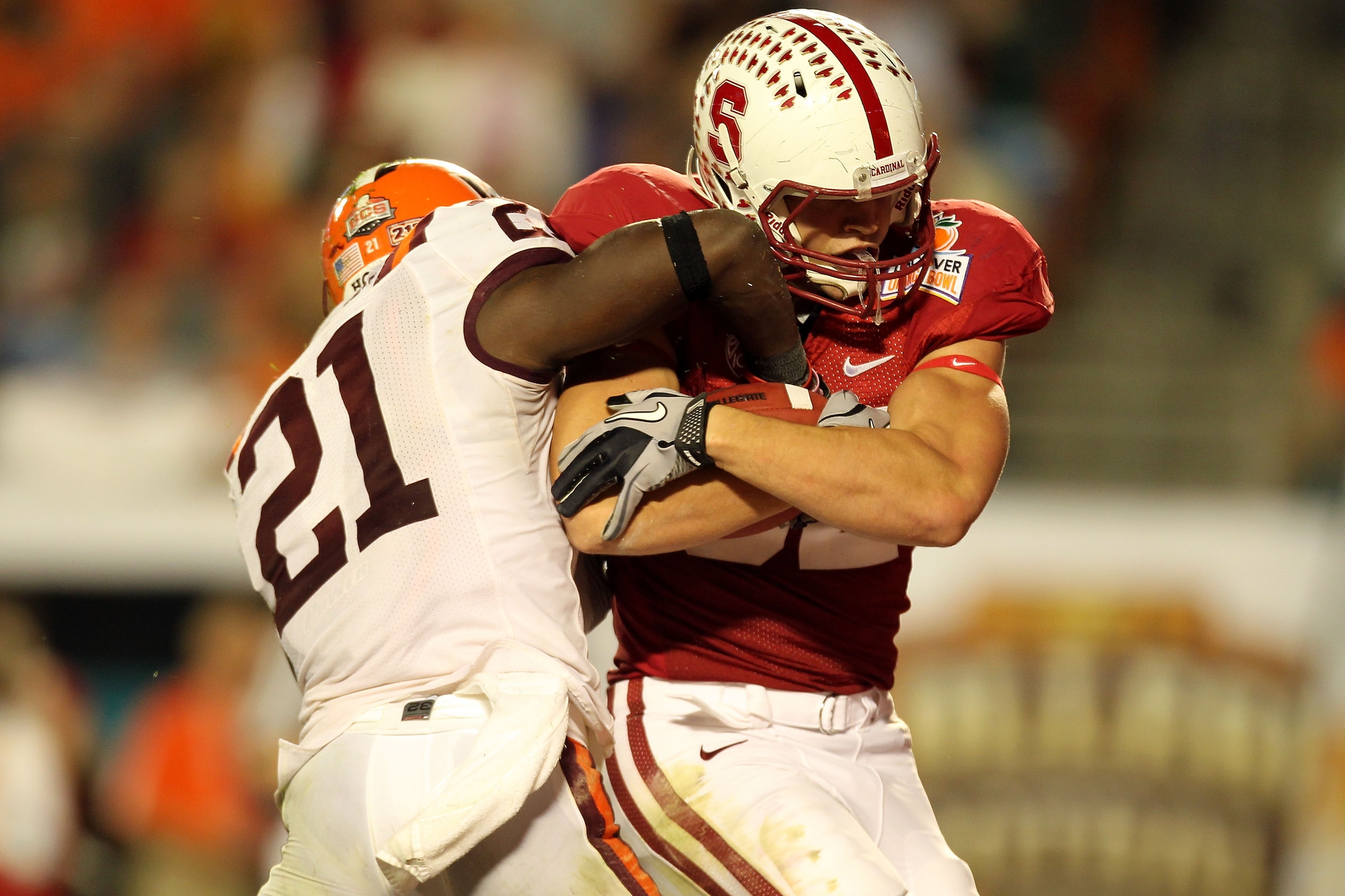 MIAMI, FL - JANUARY 03: Coby Fleener #82 of the Stanford Cardinal scores a 41-yard tochdown reception in the third quarter against Rashad Carmichael #21 of the Virginia Tech Hokies during the 2011 Discover Orange Bowl at Sun Life Stadium on January 3, 201