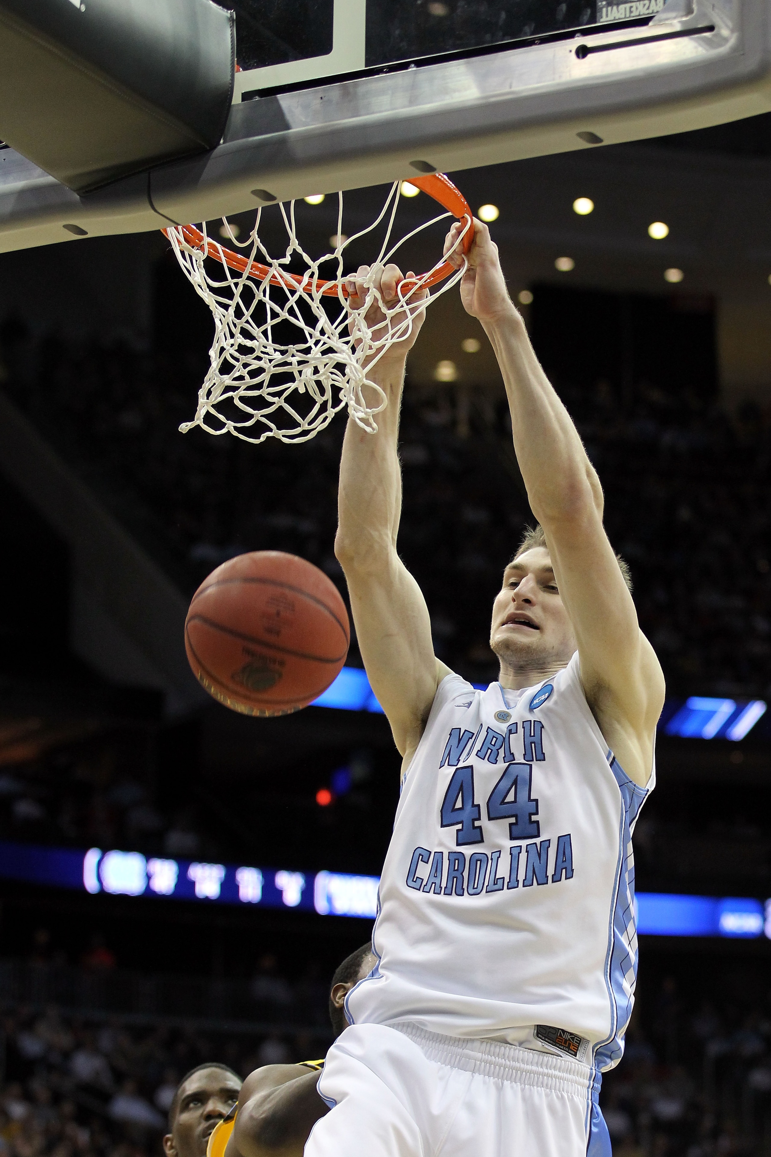 NEWARK, NJ - MARCH 25:  Tyler Zeller #44 of the North Carolina Tar Heels dunks against the Marquette Golden Eagles during the second half of the east regional semifinal of the 2011 NCAA Men's Basketball Tournament at the Prudential Center on March 25, 201