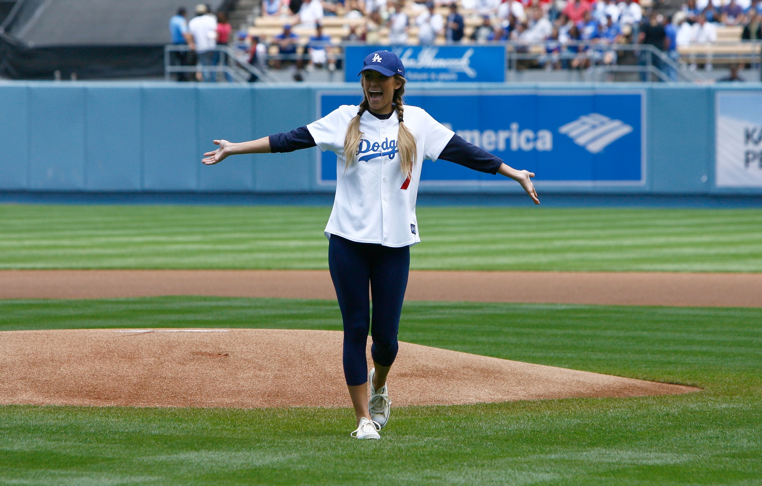 LOS ANGELES, CA - JUNE 06:  Television personality Lauren Conrad reacts after throwing out the first pitch prior to the start of the game beween the Philadelphia Phillies and the Los Angeles Dodgers at Dodger Stadium on June 6, 2009 in Los Angeles, Califo
