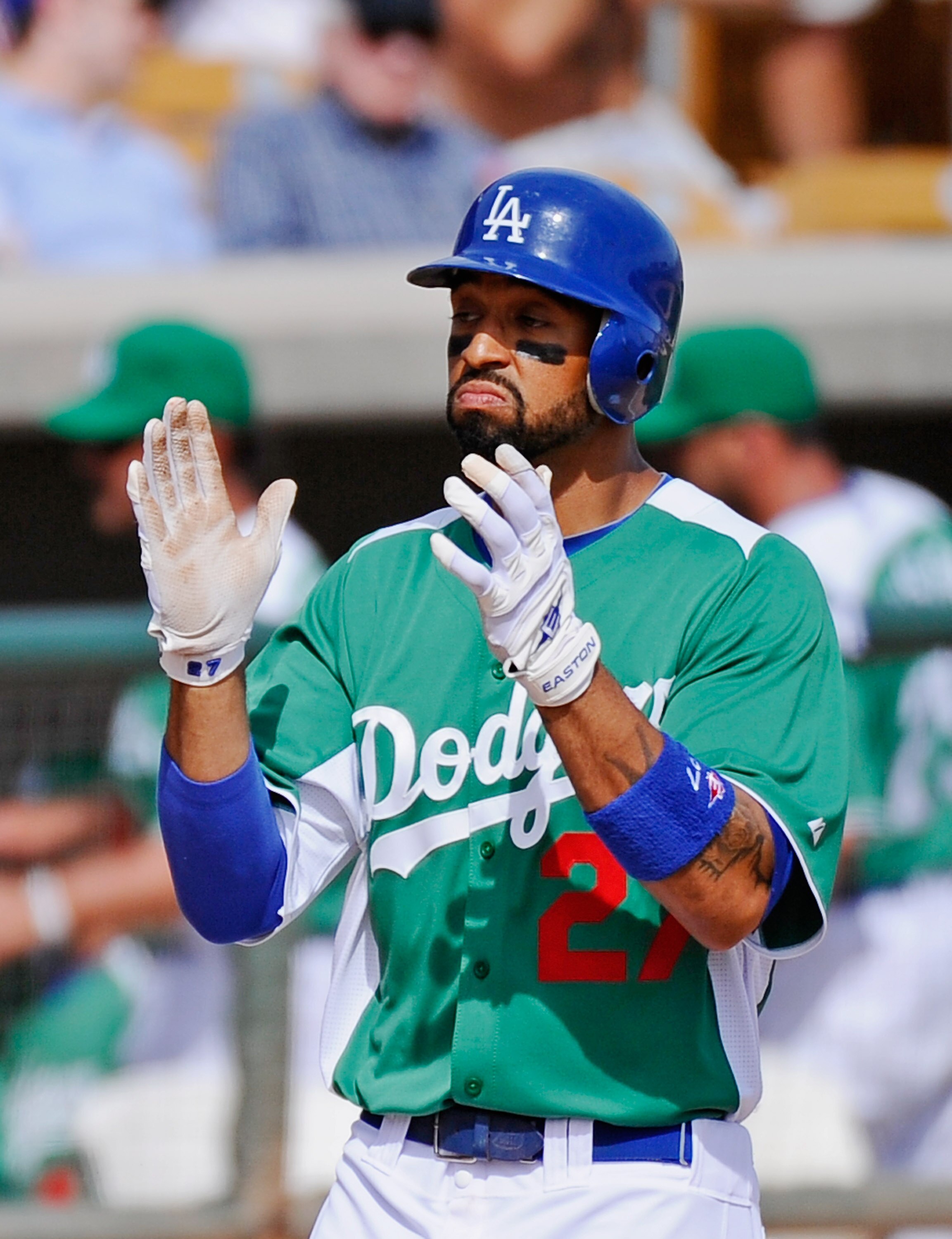 GLENDALE, AZ - MARCH 17:  Matt Kemp #27 of the Los Angeles Dodgers wearing a green jersey in celebration of St. Patrick's Day celebrates after hitting a two run home run against the Arizona Diamondbacks during the spring training baseball game on March 17