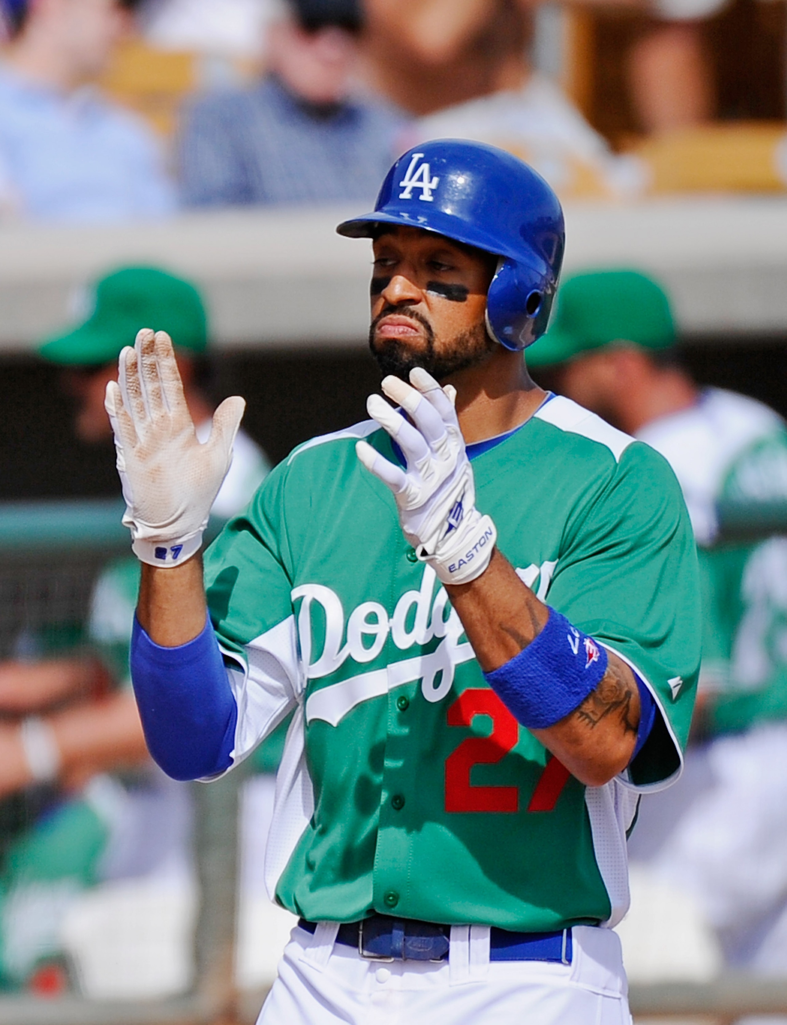 GLENDALE, AZ - MARCH 17:  Matt Kemp #27 of the Los Angeles Dodgers wearing a green jersey in celebration of St. Patrick's Day celebrates after hitting a two run home run against the Arizona Diamondbacks during the spring training baseball game on March 17