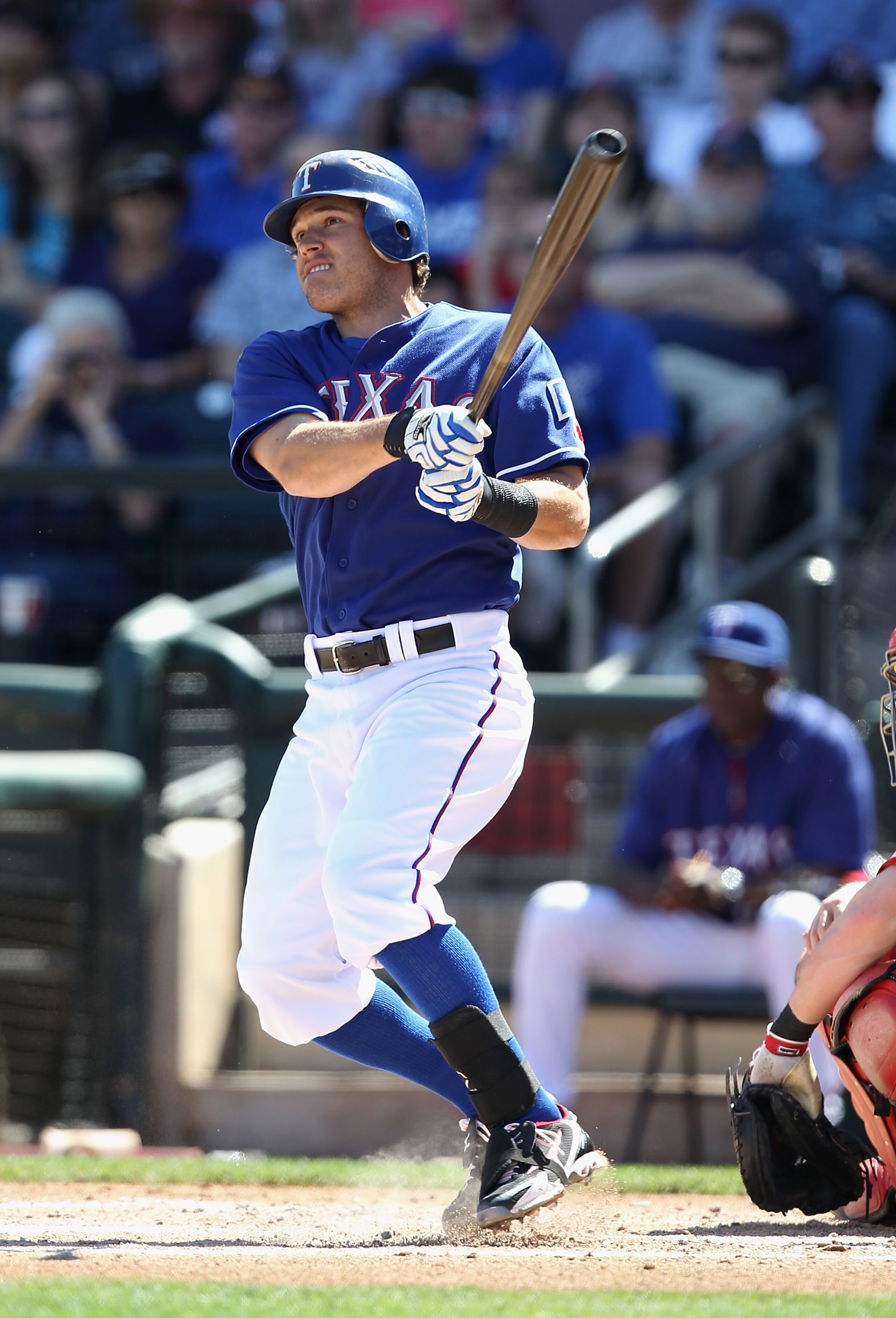 SURPRISE, AZ - MARCH 11:  Ian Kinsler #5 of the Texas Rangers hits a double against the Cincinnati Reds during the first inning of the spring training game at Surprise Stadium on March 11, 2011 in Surprise, Arizona.  (Photo by Christian Petersen/Getty Ima