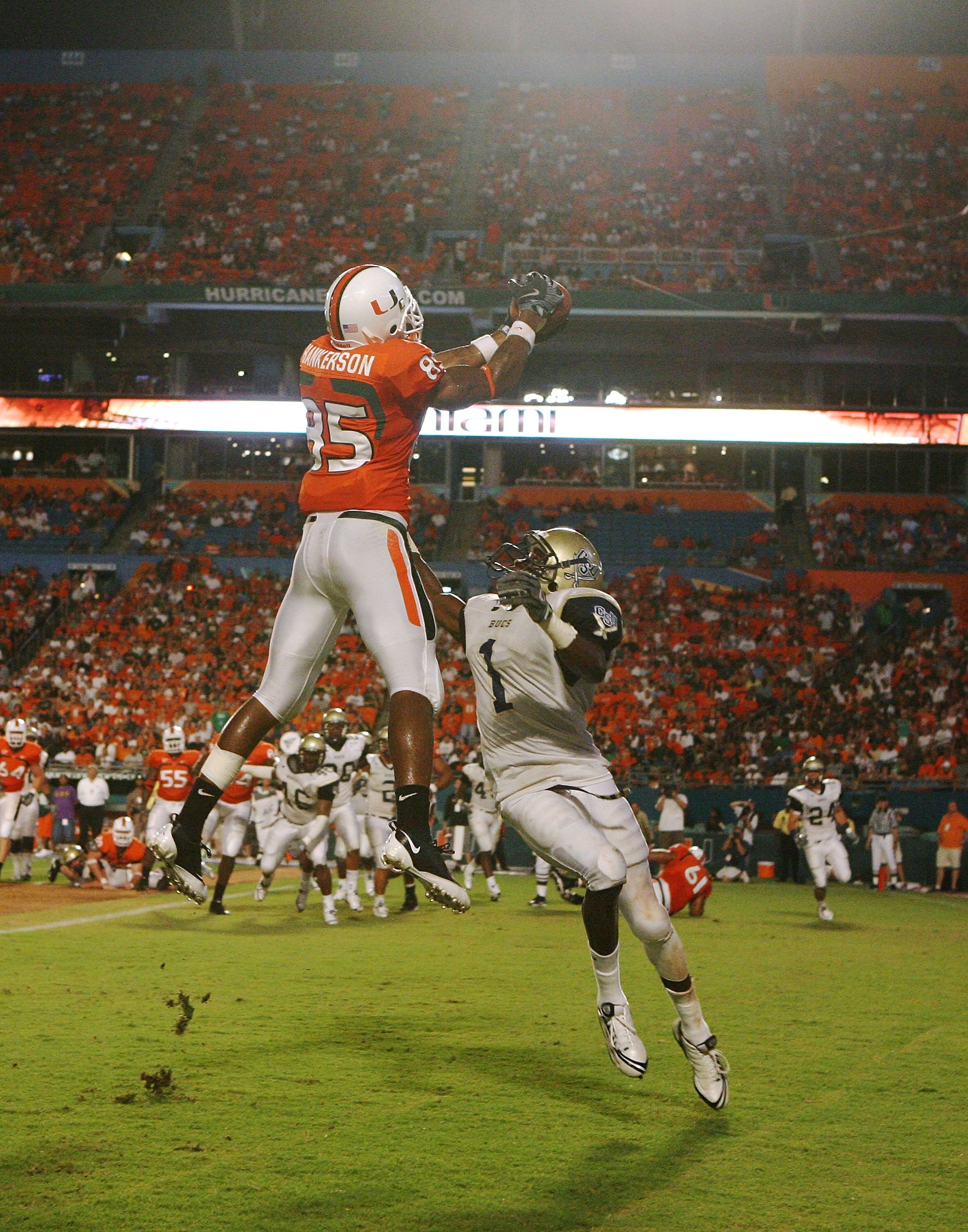 MIAMI - AUGUST 28:  Defensive back Phillip Ashley #1 of the Charleston Southern Buccaneers tries ot knock down a pass intended for wide receiver Leonard Hankerson #85 of the Miami Hurricanes at Dolphin Stadium on August 28, 2008 in Miami, Florida. Miami d