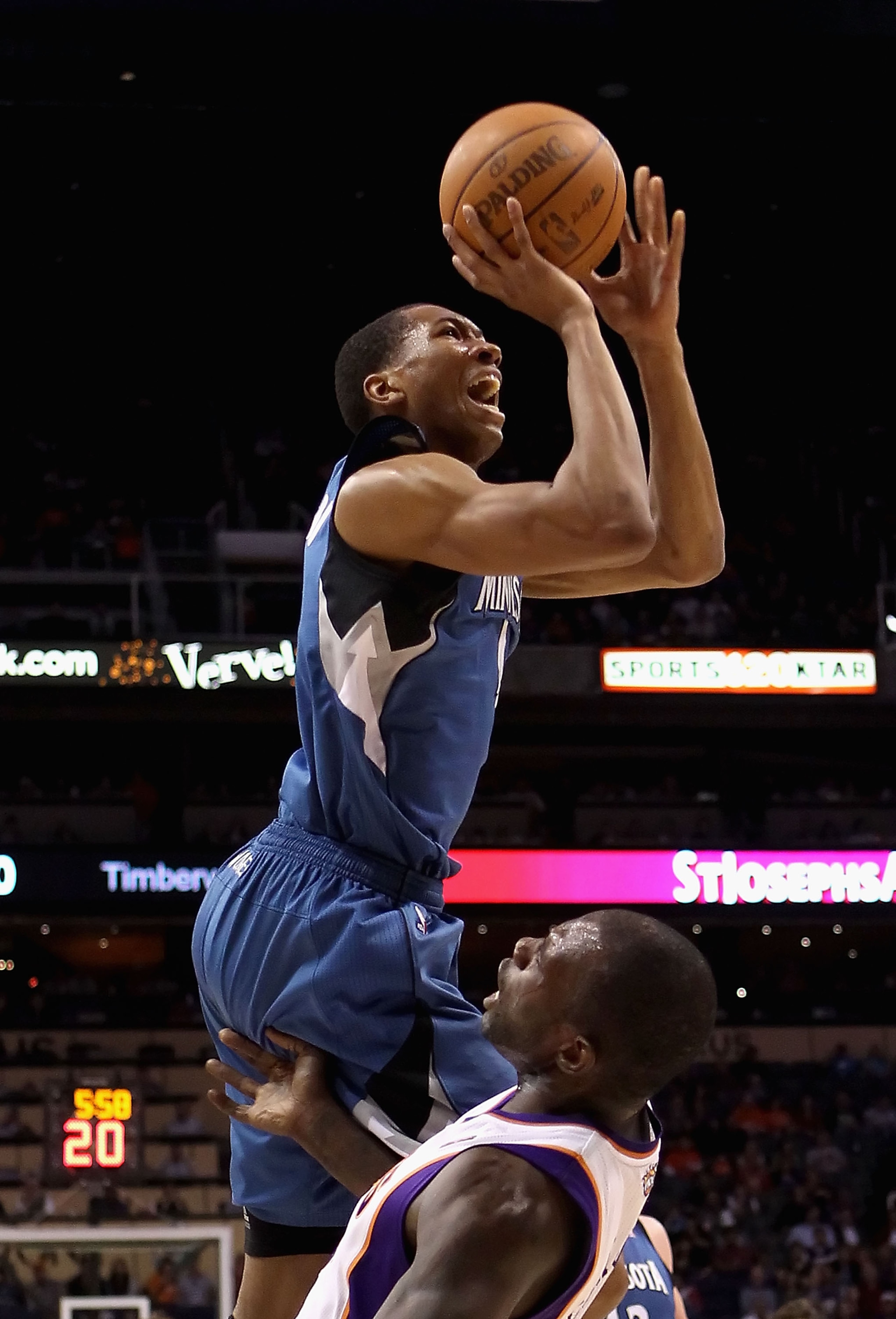 PHOENIX - DECEMBER 15:  Wesley Johnson #4 of the Minnesota Timberwolves drives to the basket over Grant Hill #13 of the Phoenix Suns during the NBA game at US Airways Center on December 15, 2010 in Phoenix, Arizona. The Suns defeated the Timberwolves 128-