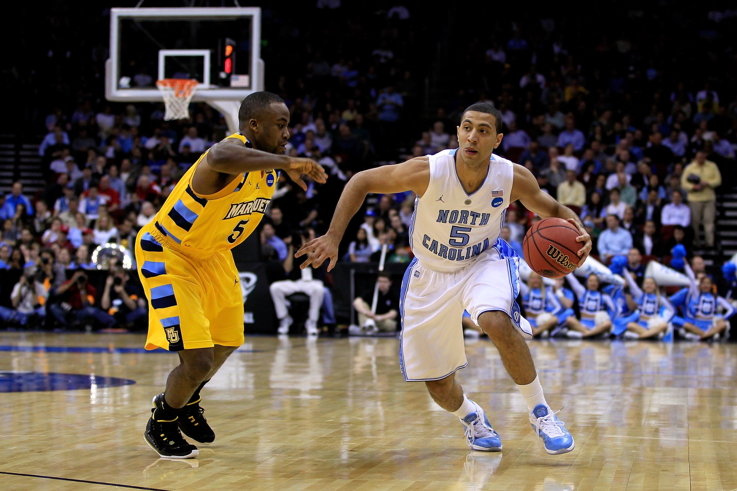 NEWARK, NJ - MARCH 25: Kendall Marshall #5 of the North Carolina Tar Heels dribbles the ball against Junior Cadougan #5 of the Marquette Golden Eagles during the first half of the east regional semifinal of the 2011 NCAA Men's Basketball Tournament at th NEWARK, NJ - MARCH 25: Kendall Marshall #5 of the North Carolina Tar Heels dribbles the ball against Junior Cadougan #5 of the Marquette Golden Eagles during the first half of the east regional semifinal of the 2011 NCAA Men's Basketball Tournament at th