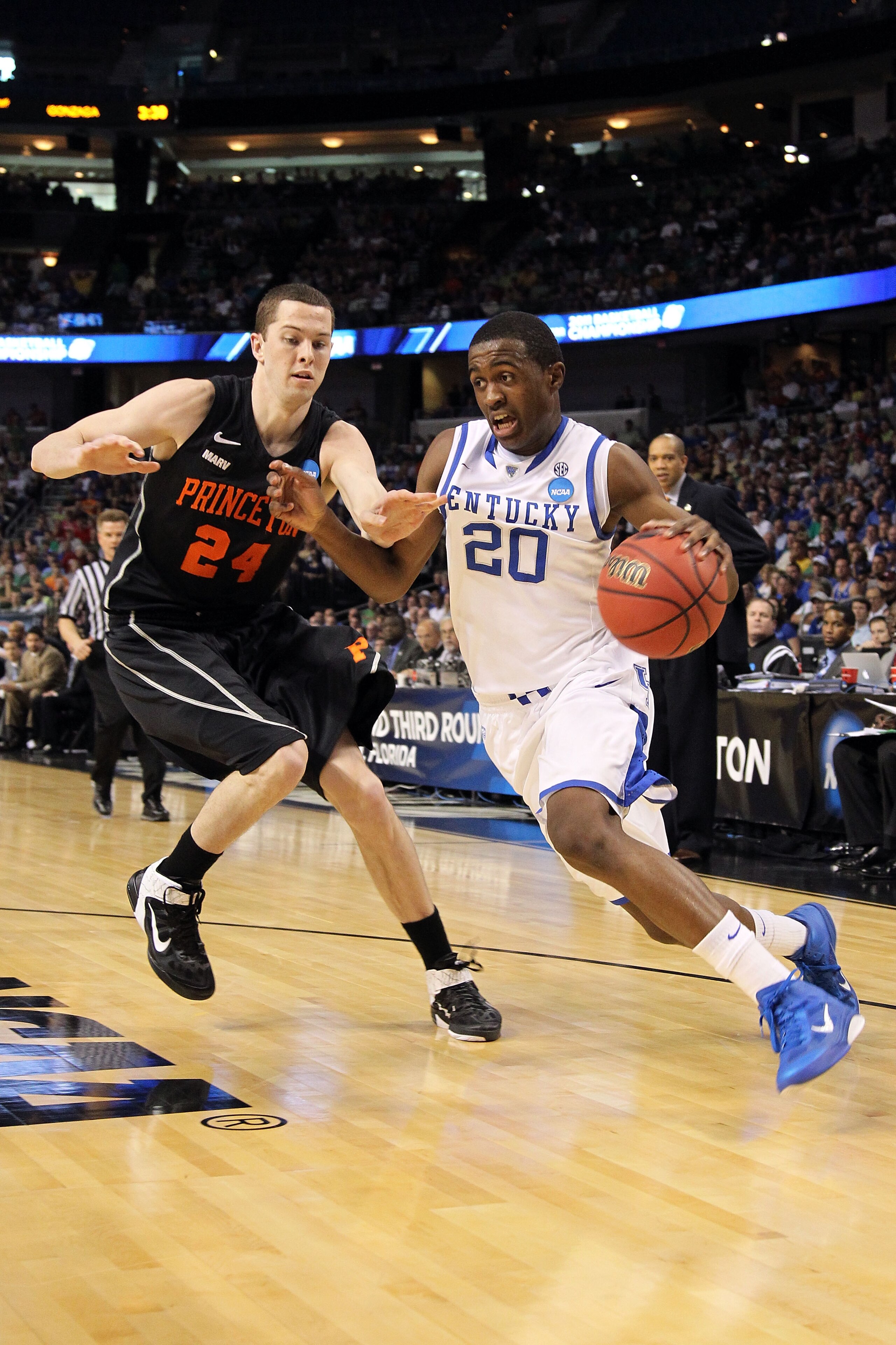 TAMPA, FL - MARCH 17: Doron Lamb #20 of the Kentucky Wildcats drives against Will Barrett #24 of the Princeton Tigers during the second round of the 2011 NCAA men's basketball tournament at St. Pete Times Forum on March 17, 2011 in Tampa, Florida. (Phot TAMPA, FL - MARCH 17: Doron Lamb #20 of the Kentucky Wildcats drives against Will Barrett #24 of the Princeton Tigers during the second round of the 2011 NCAA men's basketball tournament at St. Pete Times Forum on March 17, 2011 in Tampa, Florida. (Phot
