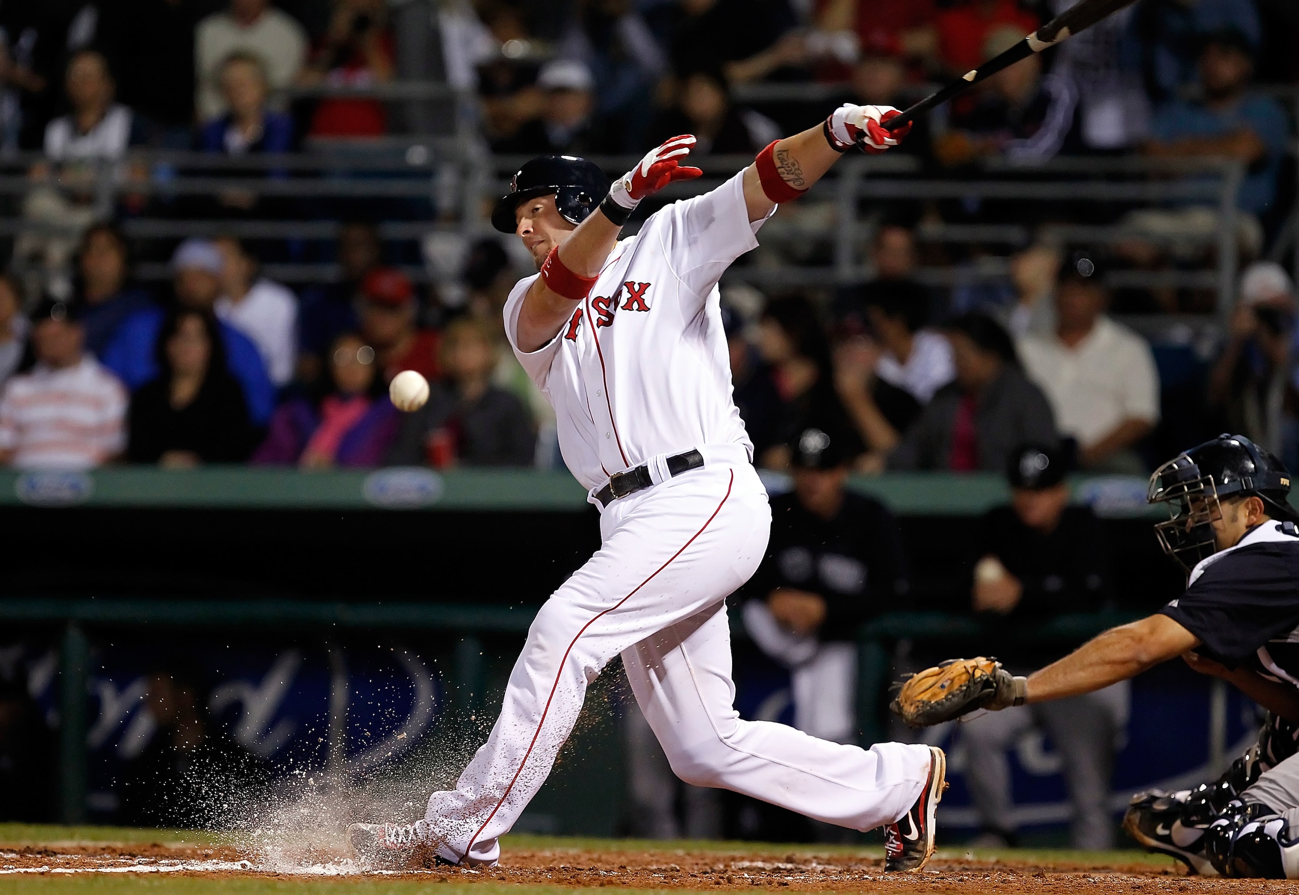 FORT MYERS, FL - MARCH 14:  Catcher Jarrod Saltalamacchia #39 of the Boston Red Sox fouls off a pitch against the New York Yankees during a Grapefruit League Spring Training Game at City of Palms Park on March 14, 2011 in Fort Myers, Florida.  (Photo by J