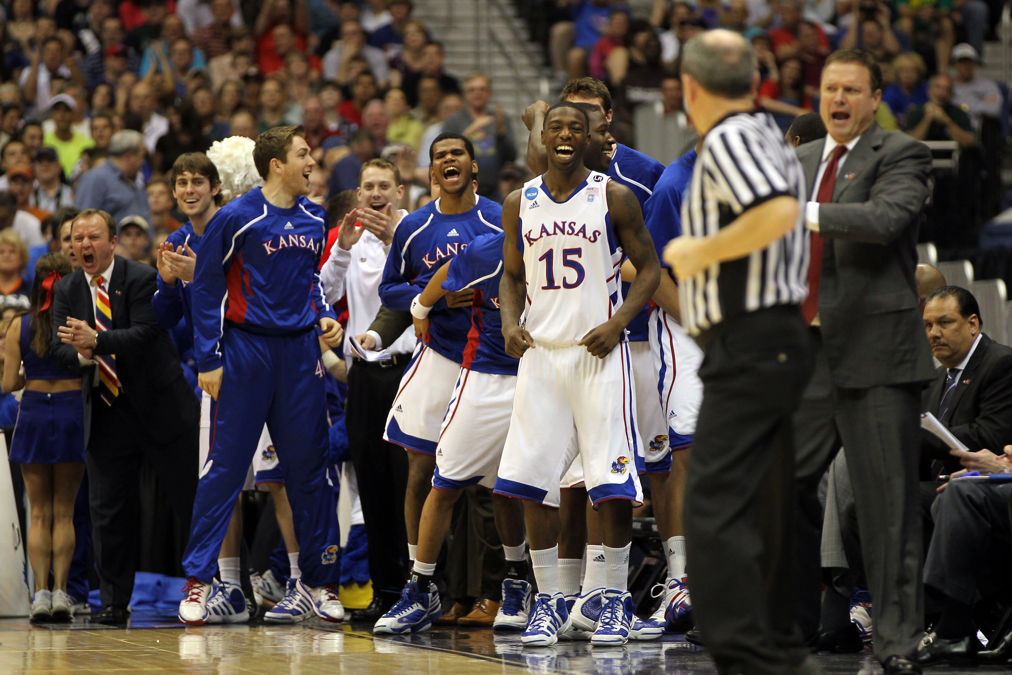 SAN ANTONIO, TX - MARCH 25:  Elijah Johnson #15 of the Kansas Jayhawks celebrates from the bench during the southwest regional of the 2011 NCAA men's basketball tournament against the Richmond Spiders at the Alamodome on March 25, 2011 in San Antonio, Tex