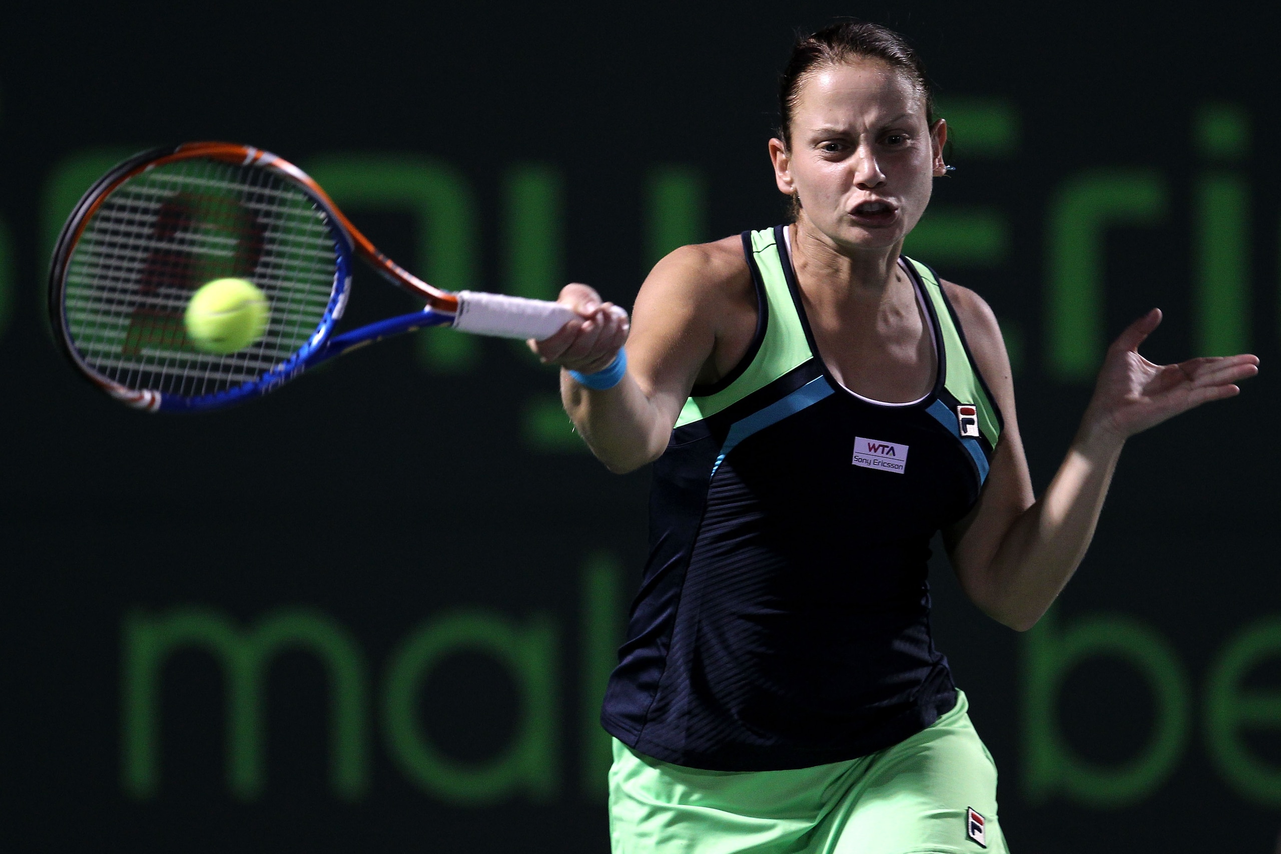 KEY BISCAYNE, FL - MARCH 23:  Jelena Dokic of Australia returns against Dinara Safina of Russia during the Sony Ericsson Open at Crandon Park Tennis Center on March 23, 2011 in Key Biscayne, Florida.  (Photo by Al Bello/Getty Images)