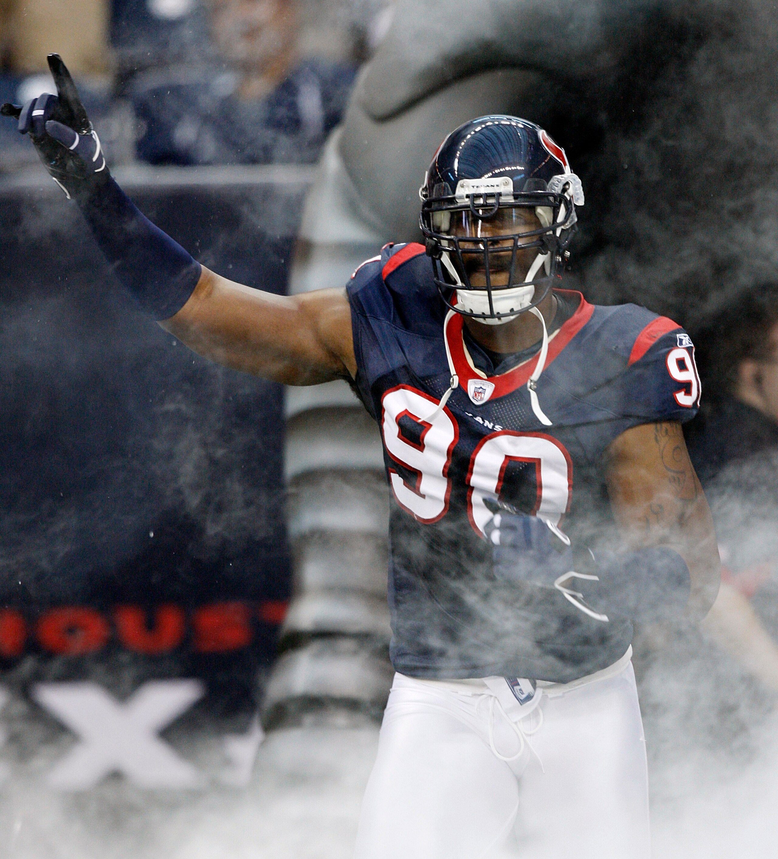HOUSTON - AUGUST 28:  Defensive end Mario Williams #90 of the Houston Texans is introduced before a preseason game against the Dallas Cowoys at Reliant Stadium on August 28, 2010 in Houston, Texas.  (Photo by Bob Levey/Getty Images)