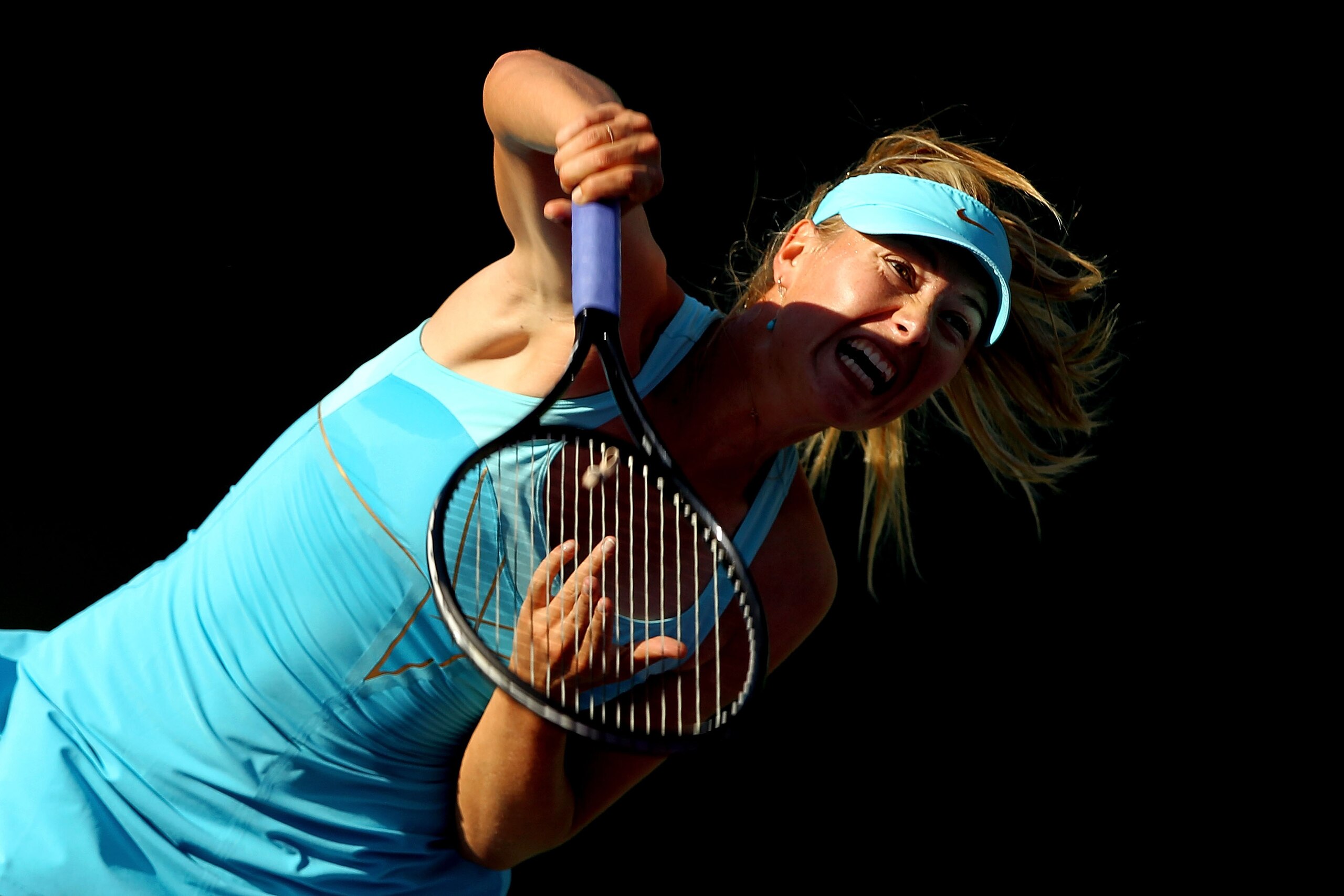 KEY BISCAYNE, FL - MARCH 26:  Maria Sharapova of Russia serves against Sabine Lisicki of Germany during the Sony Ericsson Open at Crandon Park Tennis Center on March 26, 2011 in Key Biscayne, Florida.  (Photo by Al Bello/Getty Images)