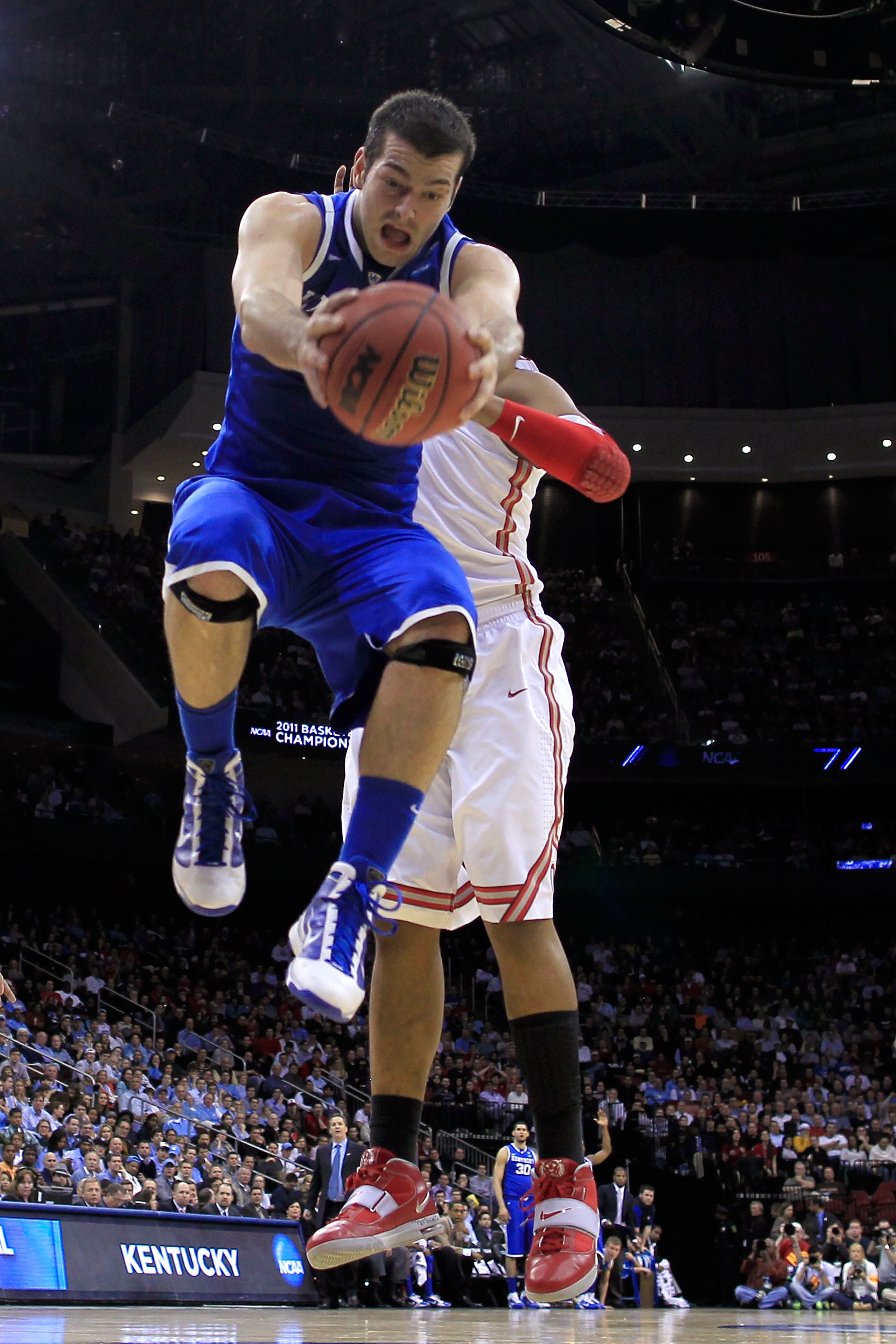NEWARK, NJ - MARCH 25: Josh Harrellson #55 of the Kentucky Wildcats in action against the Ohio State Buckeyes during the east regional semifinal of the 2011 NCAA Men's Basketball Tournament at the Prudential Center on March 25, 2011 in Newark, New Jersey NEWARK, NJ - MARCH 25: Josh Harrellson #55 of the Kentucky Wildcats in action against the Ohio State Buckeyes during the east regional semifinal of the 2011 NCAA Men's Basketball Tournament at the Prudential Center on March 25, 2011 in Newark, New Jersey