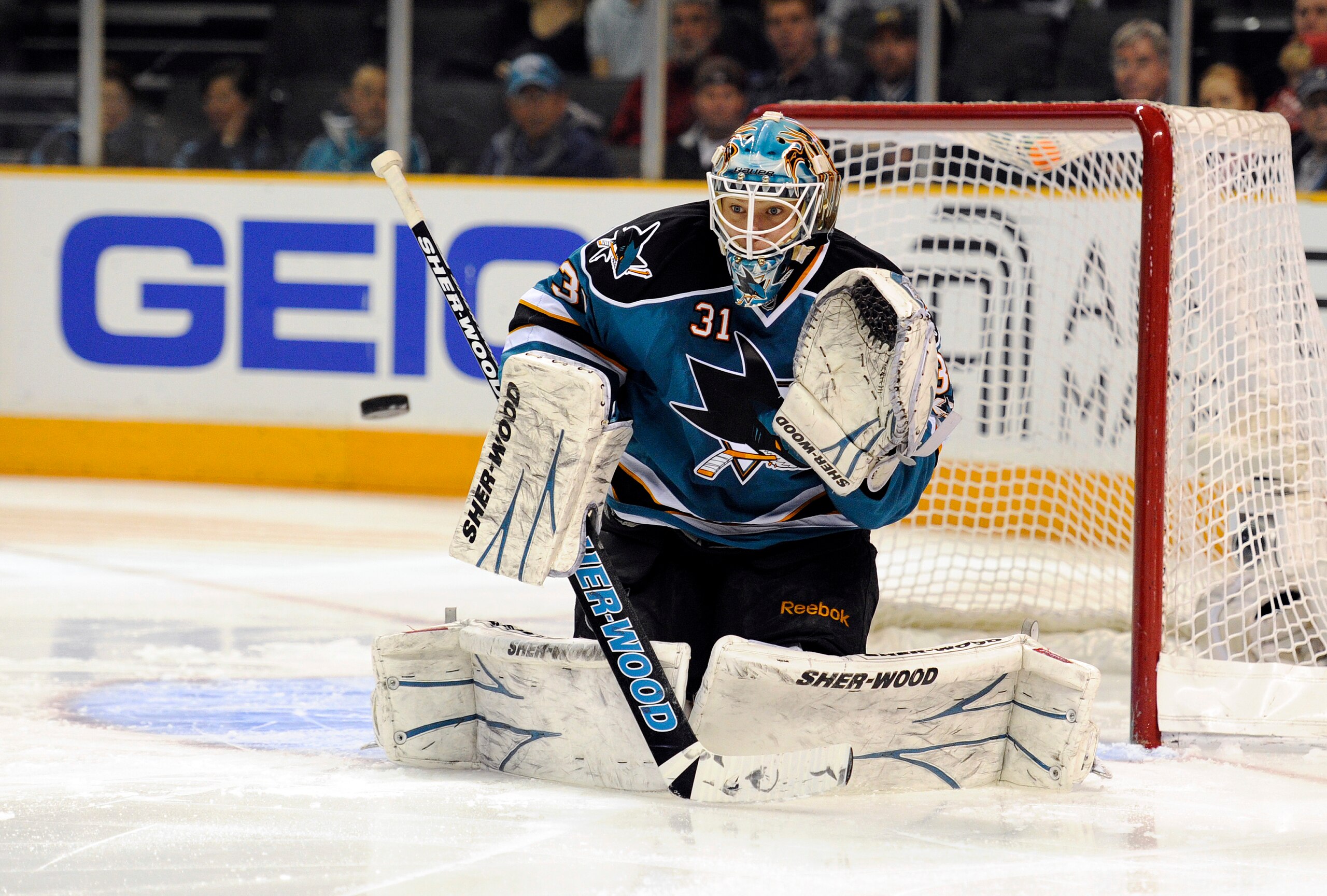 SAN JOSE, CA - MARCH 8: Goalie Antti Niemi #31 of the San Jose Sharks makes a glove hand save against the Nashville Predators in the first period of an NHL hockey game at the HP Pavilion on March 8, 2011 in San Jose, California. (Photo by Thearon W. Hende