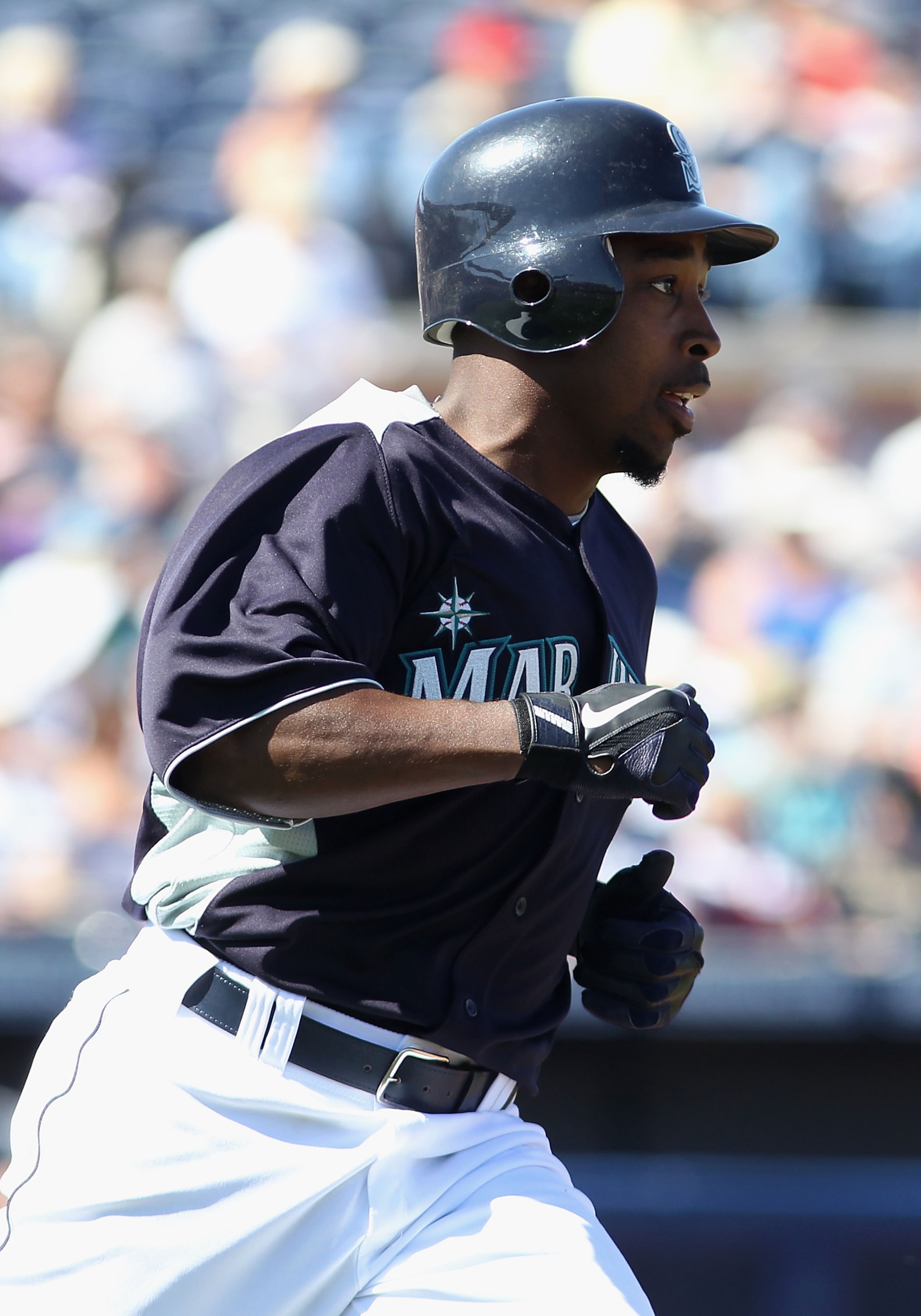 PEORIA, AZ - MARCH 04:  Chone Figgins #9 of the Seattle Mariners runs to first base during the spring training game against the Cincinnati Reds at Peoria Stadium on March 4, 2011 in Peoria, Arizona.  (Photo by Christian Petersen/Getty Images)