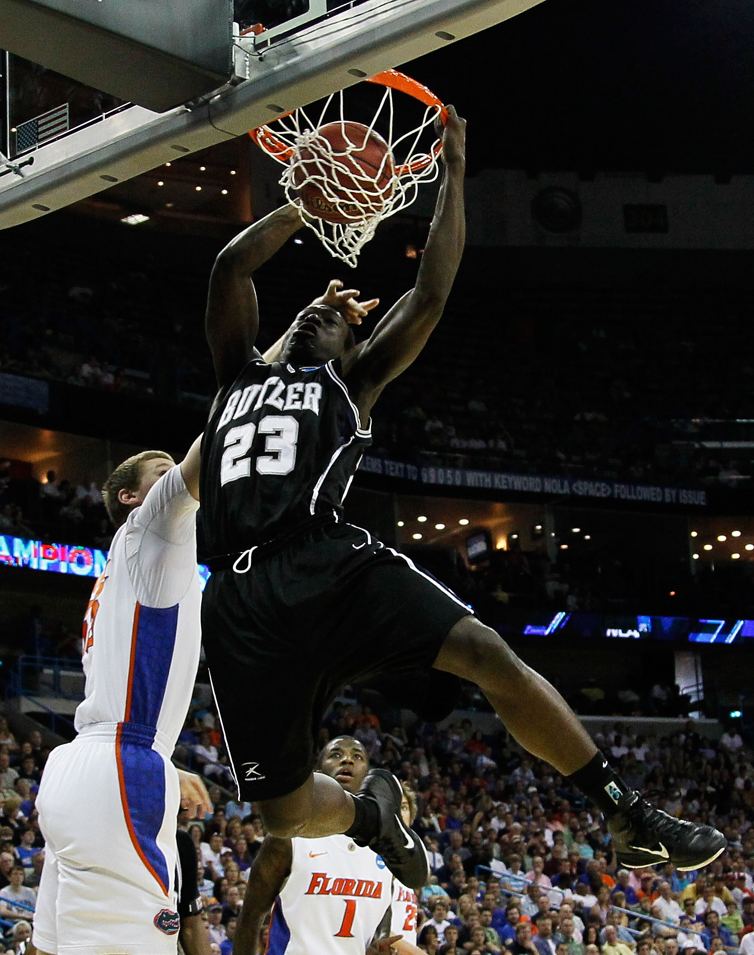 NEW ORLEANS, LA - MARCH 26: Khyle Marshall #23 of the Butler Bulldogs dunks over Erik Murphy #33 of the Florida Gators in the first half during the Southeast regional final of the 2011 NCAA men's basketball tournament at New Orleans Arena on March 26, 20