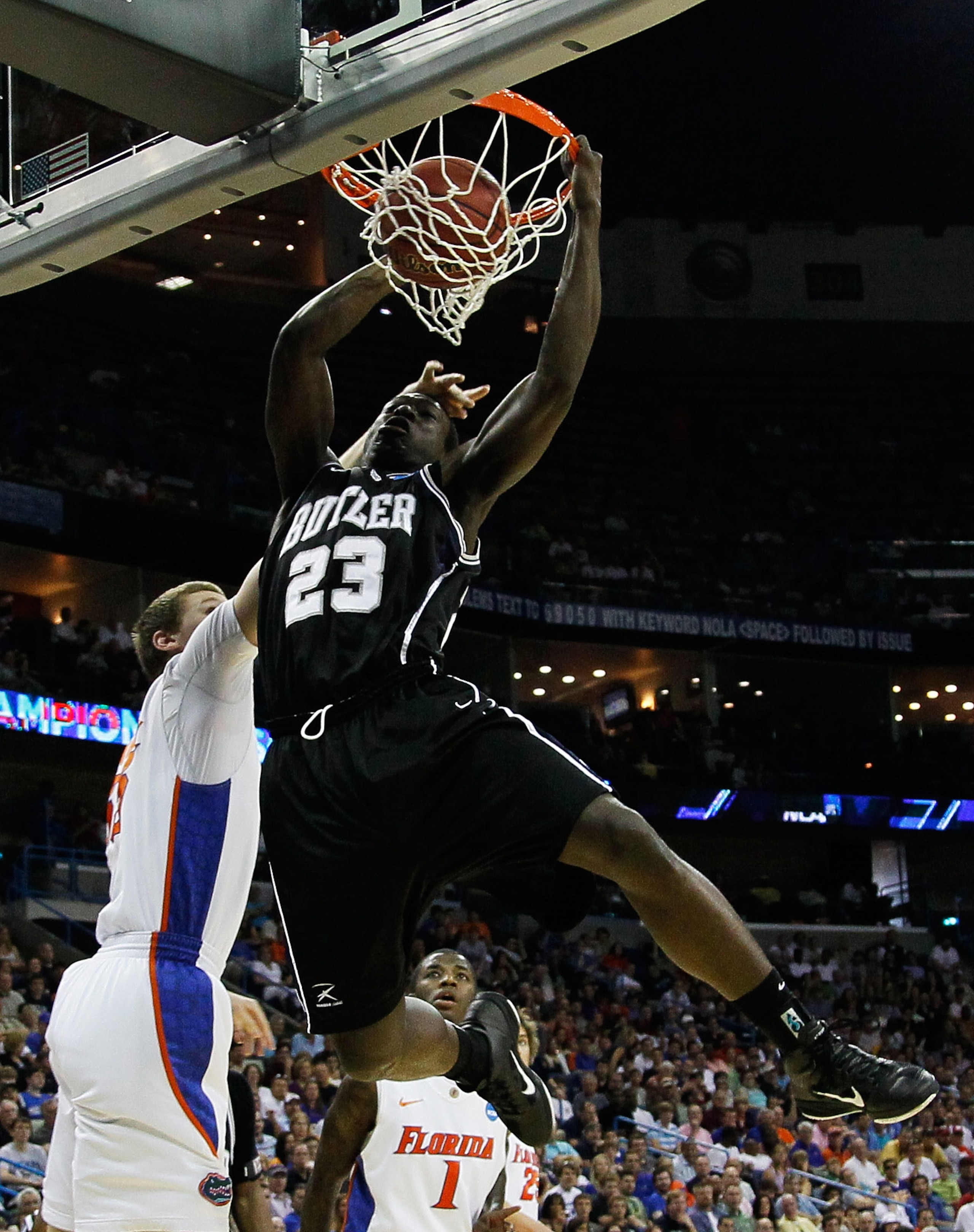 NEW ORLEANS, LA - MARCH 26:  Khyle Marshall #23 of the Butler Bulldogs dunks over Erik Murphy #33 of the Florida Gators in the first half during the Southeast regional final of the 2011 NCAA men's basketball tournament at New Orleans Arena on March 26, 20