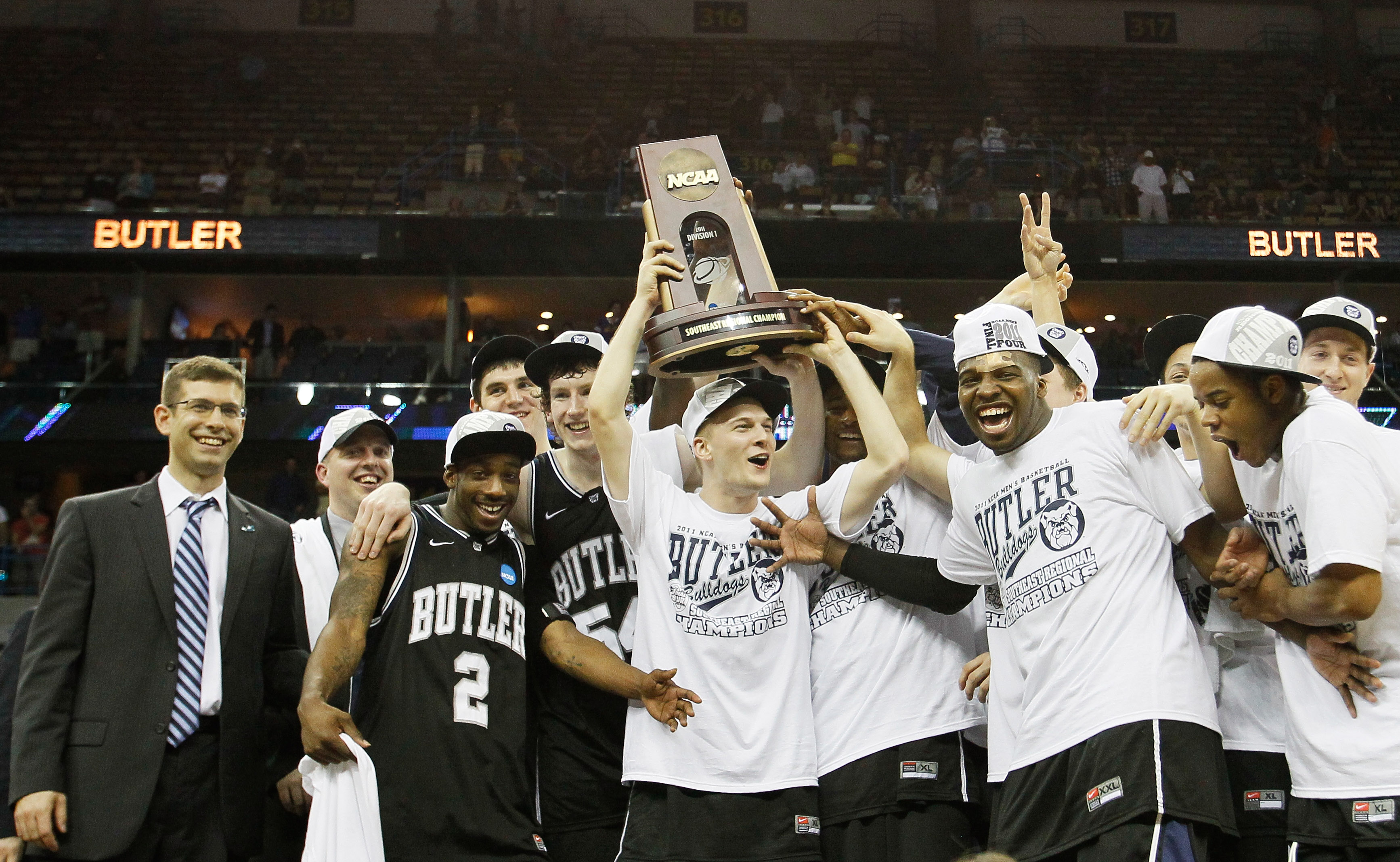 NEW ORLEANS, LA - MARCH 26:  The Butler Bulldogs celebrate with the trophy after defeating the Florida Gators 74 to 71 in overtime during the Southeast regional final of the 2011 NCAA men's basketball tournament at New Orleans Arena on March 26, 2011 in N