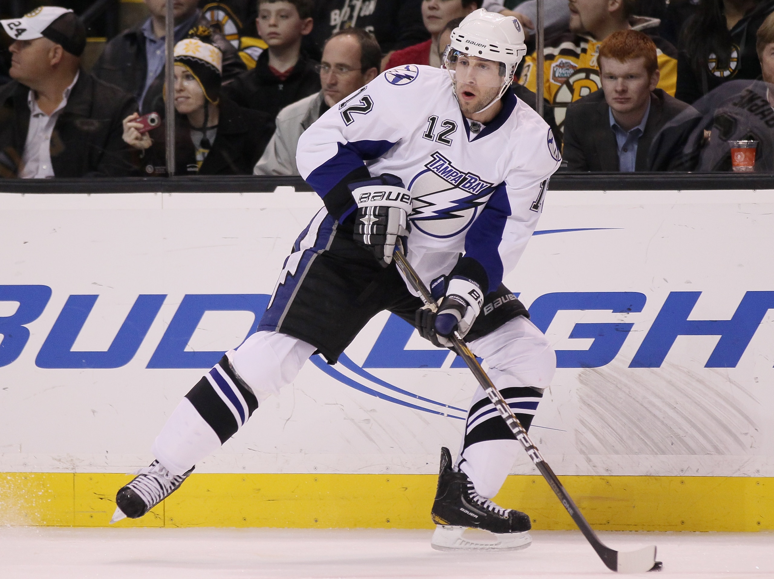 BOSTON, MA - MARCH 03:  Simon Gagne #12 of the Tampa Bay Lightning looks to pass in the second period against the Boston Bruins on March 3, 2011 at the TD Garden in Boston, Massachusetts.  (Photo by Elsa/Getty Images)