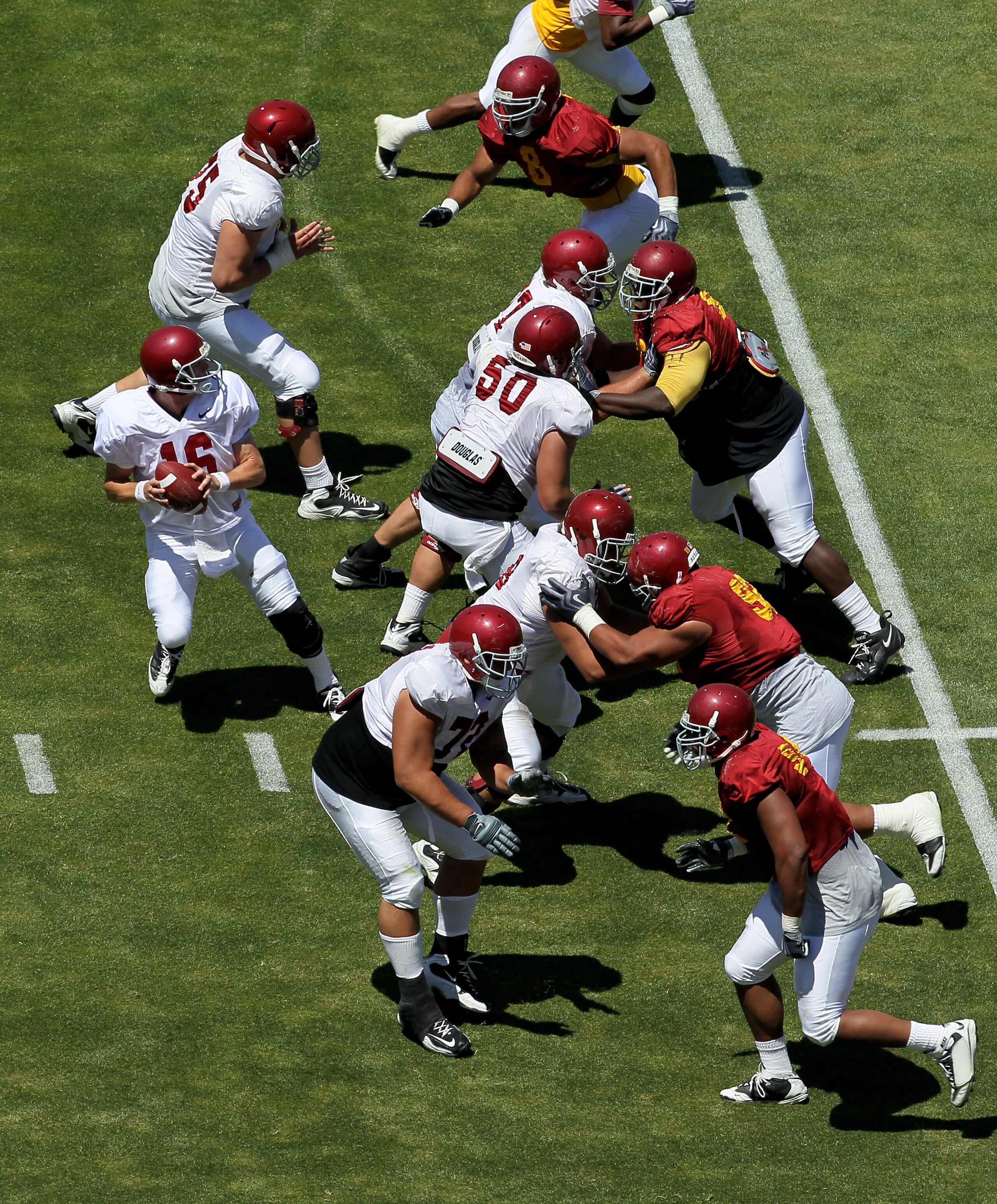 LOS ANGELES, CA - MAY 01:  Quarterback Mitch Mustain #16 drops back to pass during the  USC Trojans spring game on  May 1, 2010 at the Los Angeles Memorial Coliseum in Los Angeles, California.   (Photo by Stephen Dunn/Getty Images)