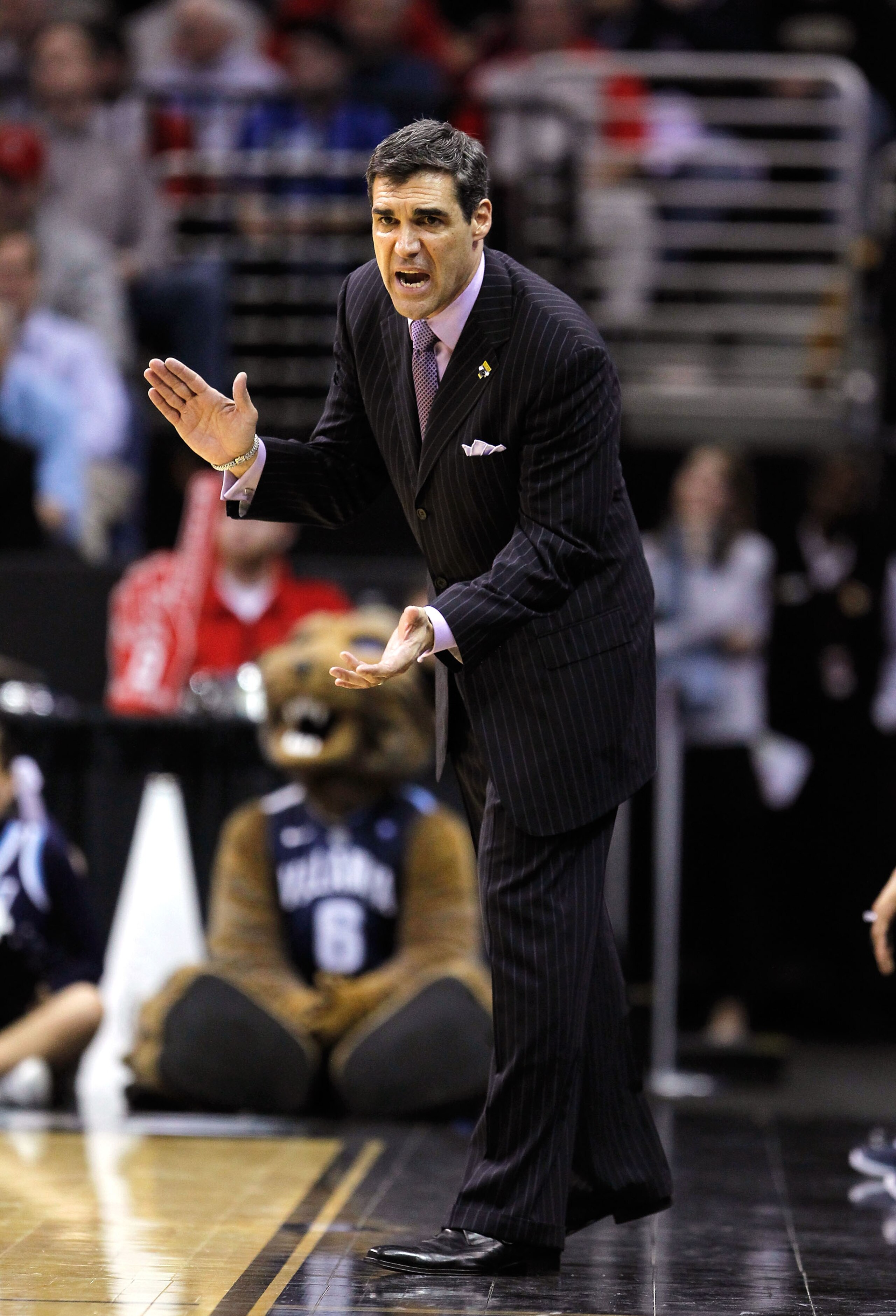 CLEVELAND, OH - MARCH 18: Head coach Jay Wright of the Villanova Wildcats reacts from the bench during the second half against the George Mason Patriots during the second round of the 2011 NCAA men's basketball tournament at Quicken Loans Arena on March 1