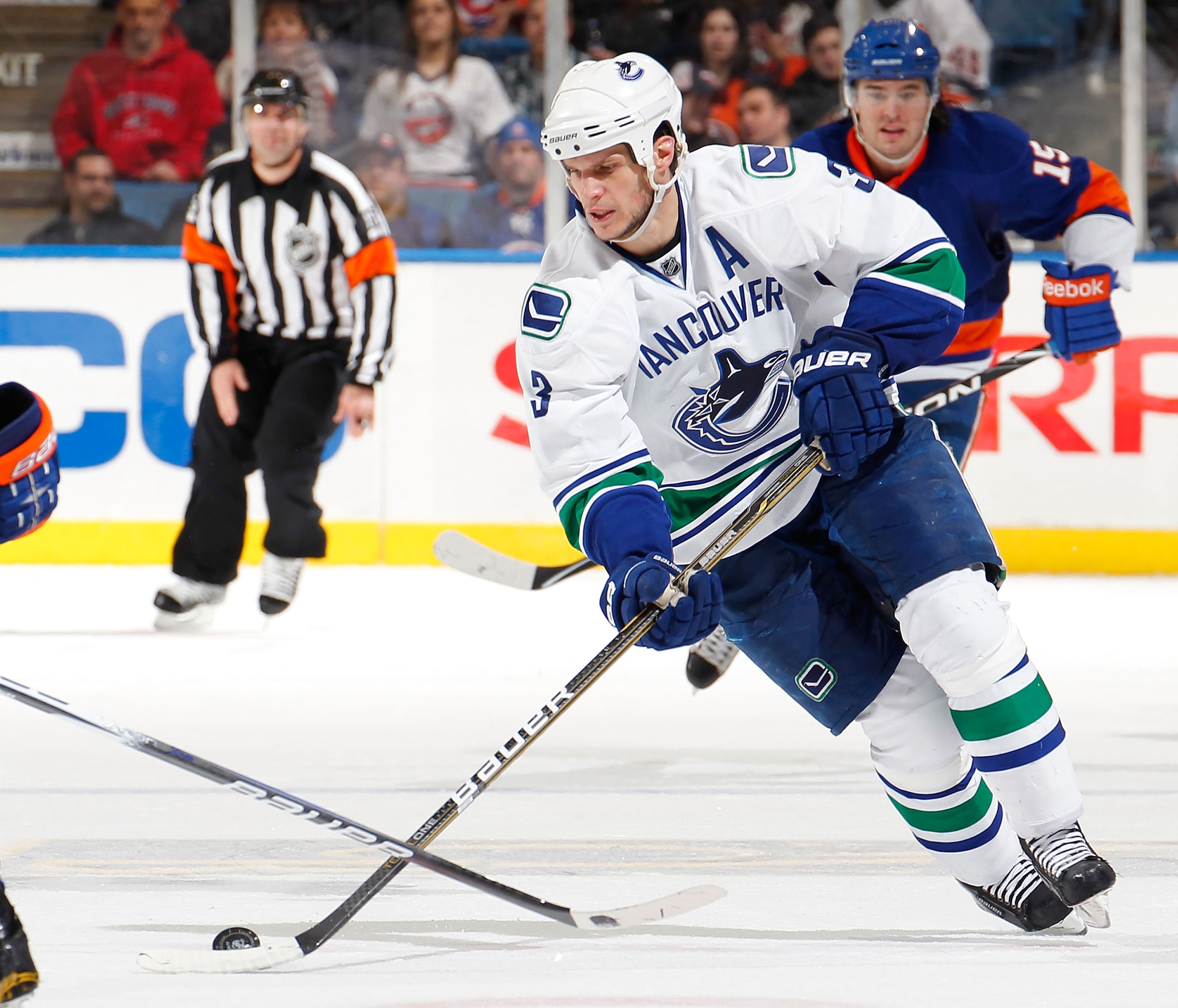 UNIONDALE, NY - JANUARY 11:  Kevin Bieksa #3 of the Vancouver Canucks skates during an NHL game against the New York Islanders at Nassau Coliseum on January 11, 2011 in Uniondale, New York.  (Photo by Paul Bereswill/Getty Images)