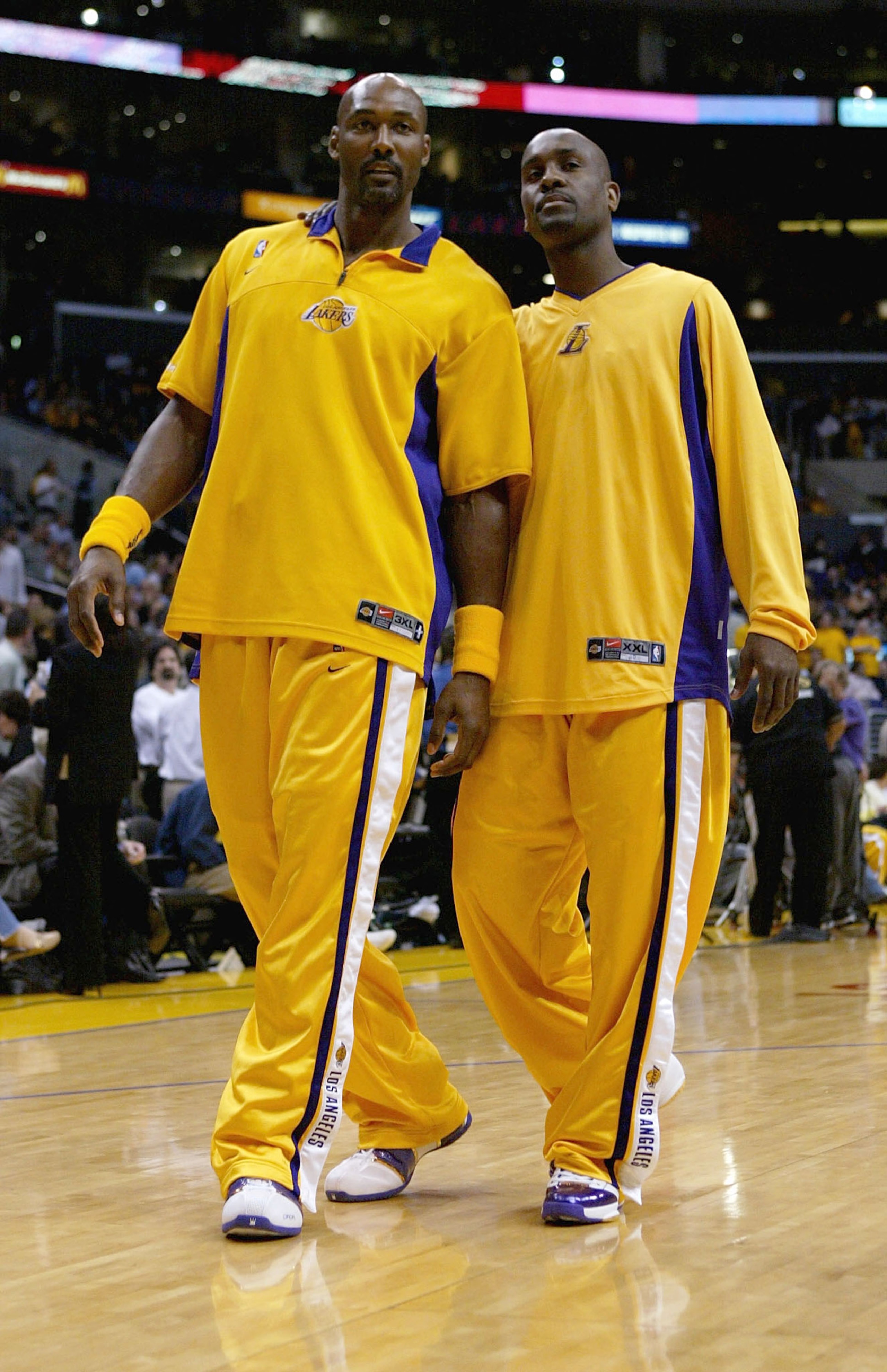LOS ANGELES - MAY 11:  Karl Malone #11 and Gary Payton #20 of the Los Angeles Lakers talk during warmups before Game four of the Western Conference Semifinals against the San Antonio Spurs during the 2004 NBA Playoffs at Staples Center on May 11, 2004 in