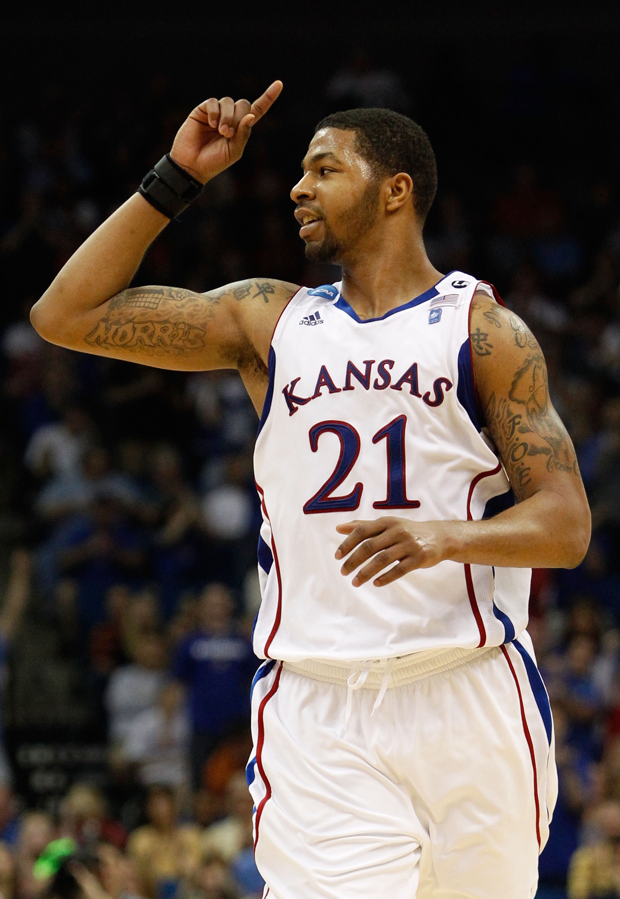 TULSA, OK - MARCH 20: Markieff Morris #21 of the Kansas Jayhawks celebrates after a play against the Illinois Fighting Illini during the third round of the 2011 NCAA men's basketball tournament at BOK Center on March 20, 2011 in Tulsa, Oklahoma. (Photo TULSA, OK - MARCH 20: Markieff Morris #21 of the Kansas Jayhawks celebrates after a play against the Illinois Fighting Illini during the third round of the 2011 NCAA men's basketball tournament at BOK Center on March 20, 2011 in Tulsa, Oklahoma. (Photo