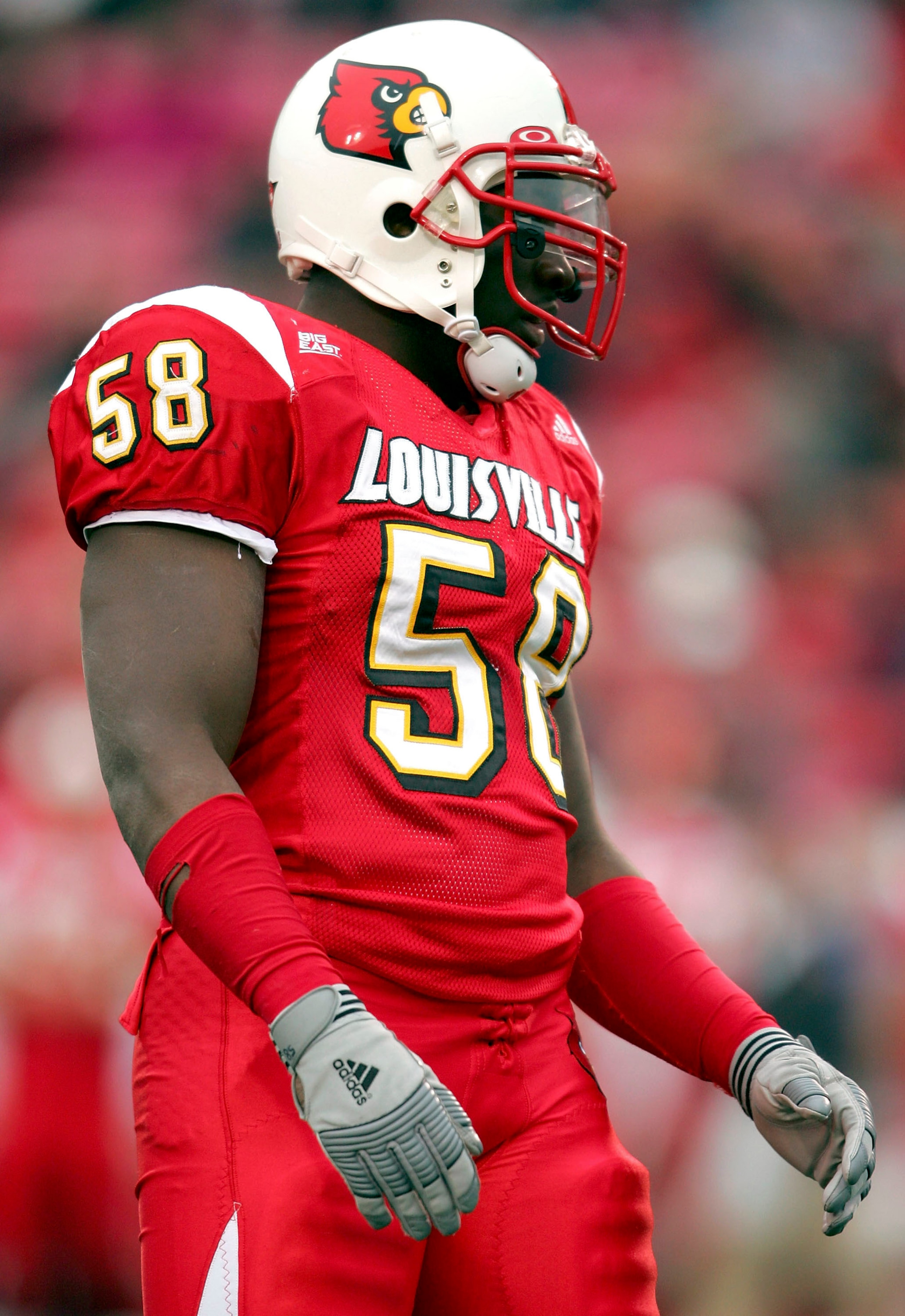 LOUISVILLE, KY - NOVEMBER 26:  Elvis Dumervil #58 of Louisville looks on in the first quarter against Syracuse November 26, 2005 at Papa John's Cardinal Stadium in Louisville, Kentucky.  (Photo by Matthew Stockman/Getty Images)