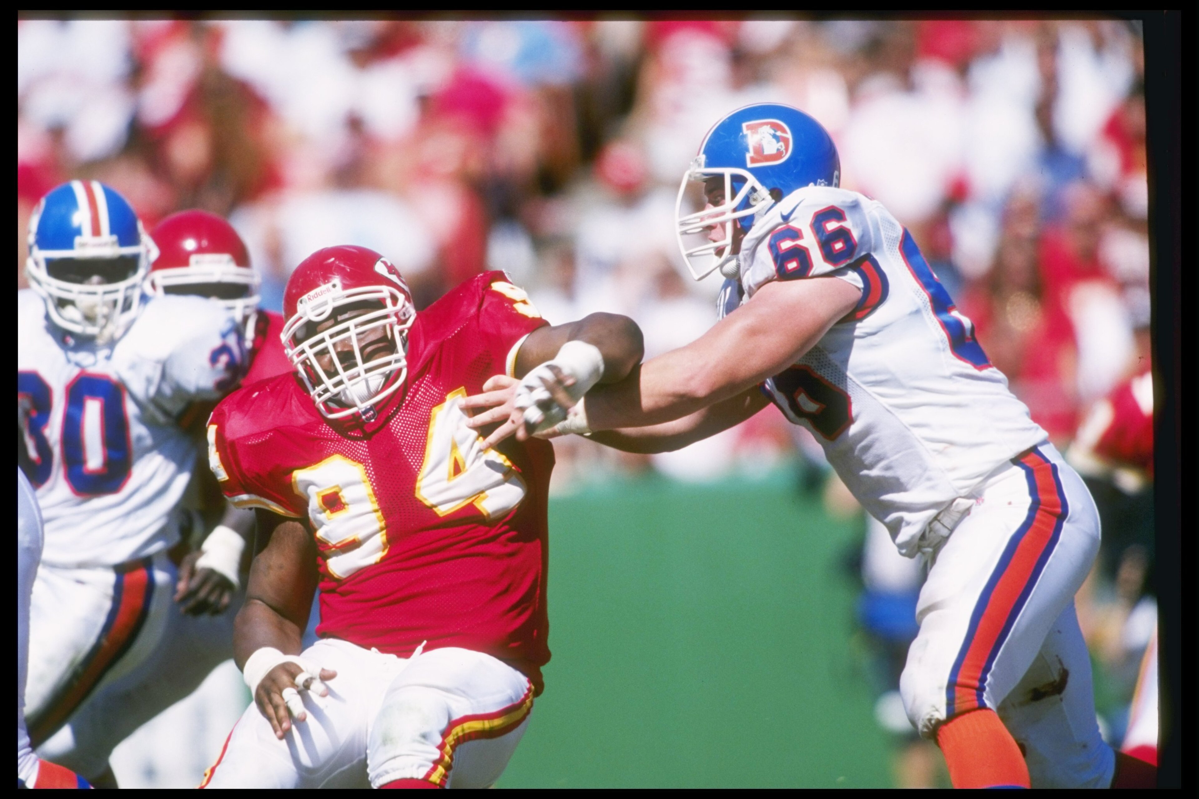 22 Sep 1996:  Offensive lineman Tom Nalen of the Denver Broncos (right) blocks Kansas City Chiefs defensive lineman Keith Traylor during a game at Arrowhead Stadium in Kansas City, Missouri.  The Chiefs won the game, 17-14. Mandatory Credit: Stephen Dunn