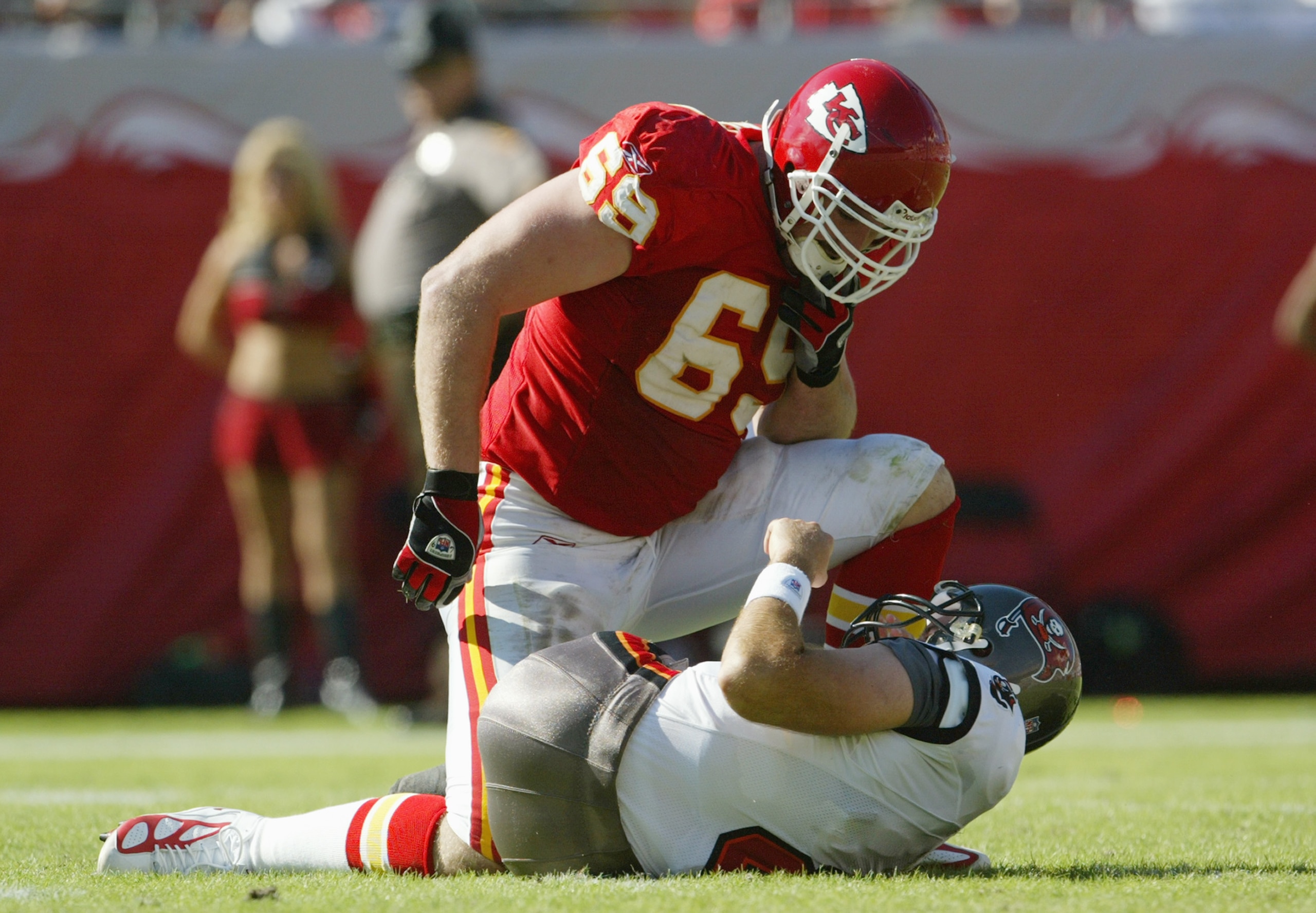 TAMPA, FL - NOVEMBER 7:  Defensive end Jared Allen #69 of the Kansas City Chiefs kneels over fallen quarterback Brian Griese #8 of the Tampa Bay Buccaneers during the game at Raymond James Stadium on November 7, 2004 in Tampa, Florida. The Buccaneers defe