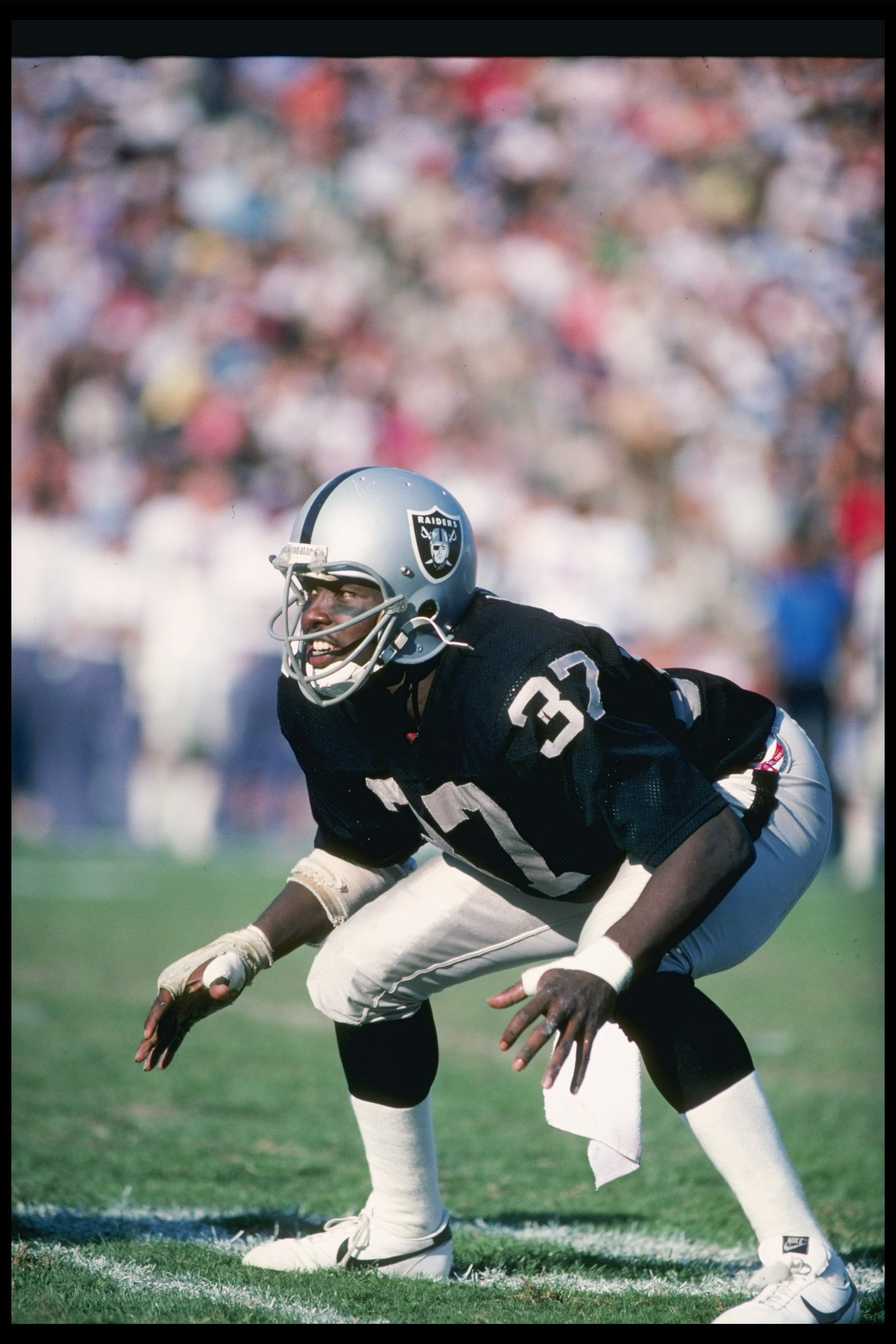 Oakland, California, USA. 7th Dec, 1980. Oakland Raiders vs Dallas Cowboys  at Oakland-Alameda County Coliseum Sunday, December 7, 1980. After the game  Oakland Defensive Back Lester Hayes (37) and Cowboys quarterback Danny