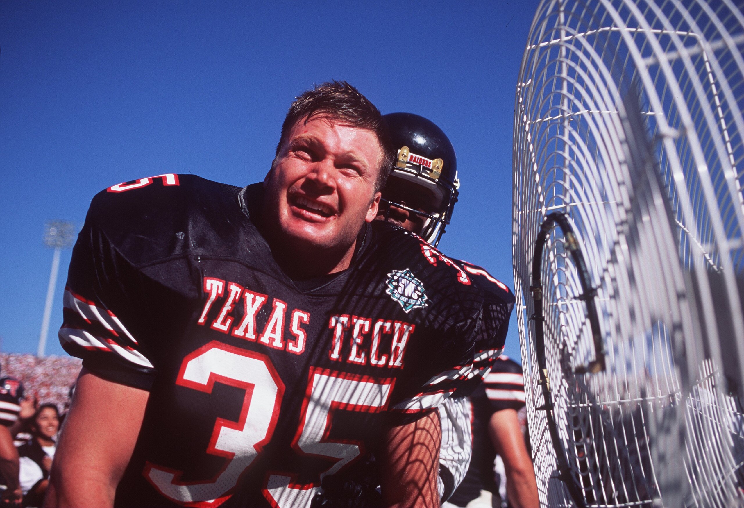 7 Oct 1995:  Linebacker Zach Thomas of Texas Tech cools off near a fan during the Red Raiders 14-7 win over Texas A&M at Jones Stadium in Lubbock, Texas. Mandatory Credit: Al Bello/ALLSPORT