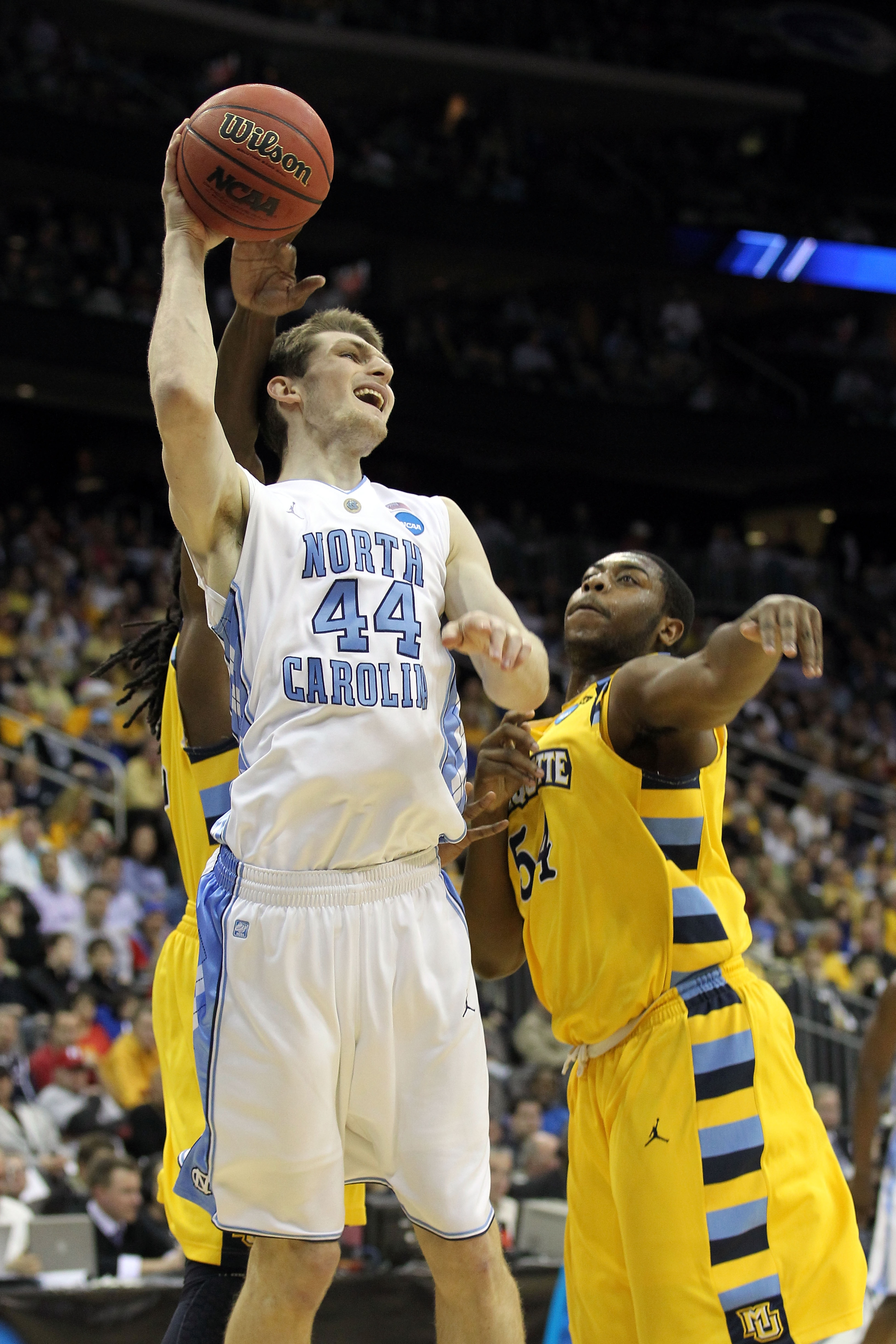 NEWARK, NJ - MARCH 25: Tyler Zeller #44 of the North Carolina Tar Heels in action against the Marquette Golden Eagles during the east regional semifinal of the 2011 NCAA Men's Basketball Tournament at the Prudential Center on March 25, 2011 in Newark, Ne NEWARK, NJ - MARCH 25: Tyler Zeller #44 of the North Carolina Tar Heels in action against the Marquette Golden Eagles during the east regional semifinal of the 2011 NCAA Men's Basketball Tournament at the Prudential Center on March 25, 2011 in Newark, Ne